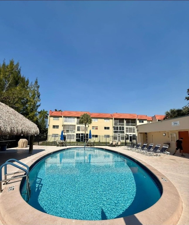 Well-maintained corner unit on the main floor in the desirable Sunrise Lakes 55+ community. This residence is in good condition and has been well cared for, offering a functional layout with abundant natural light throughout. Move-in ready and a great opportunity to customize to your taste. Enjoy peaceful living with access to community amenities including clubhouse, pool, and recreational facilities. Conveniently located near shopping, dining, and major roadways. Perfect for seasonal or full-time residence.
