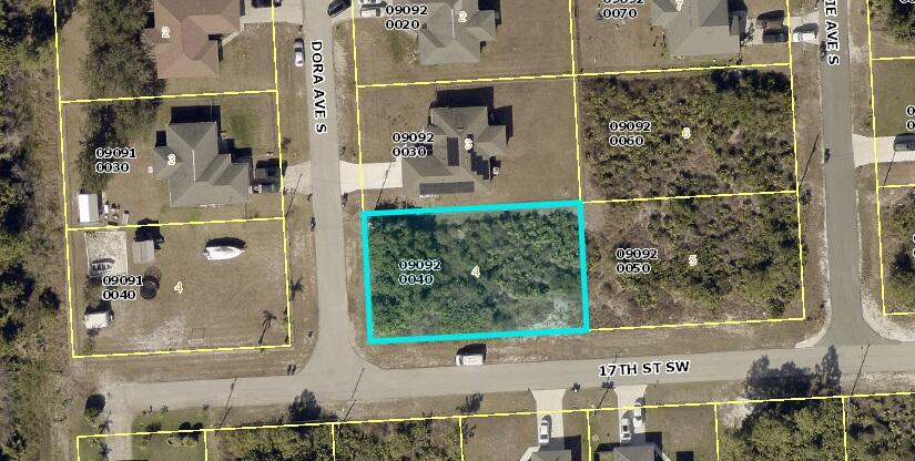 corner lot in a non gated community in Lehigh acres, Nicely located near schools, shopping, restaurants, parks, and just a short drive to Fort Myers, with easy access to SR-82, I-75, and Southwest Florida beaches. No HOA