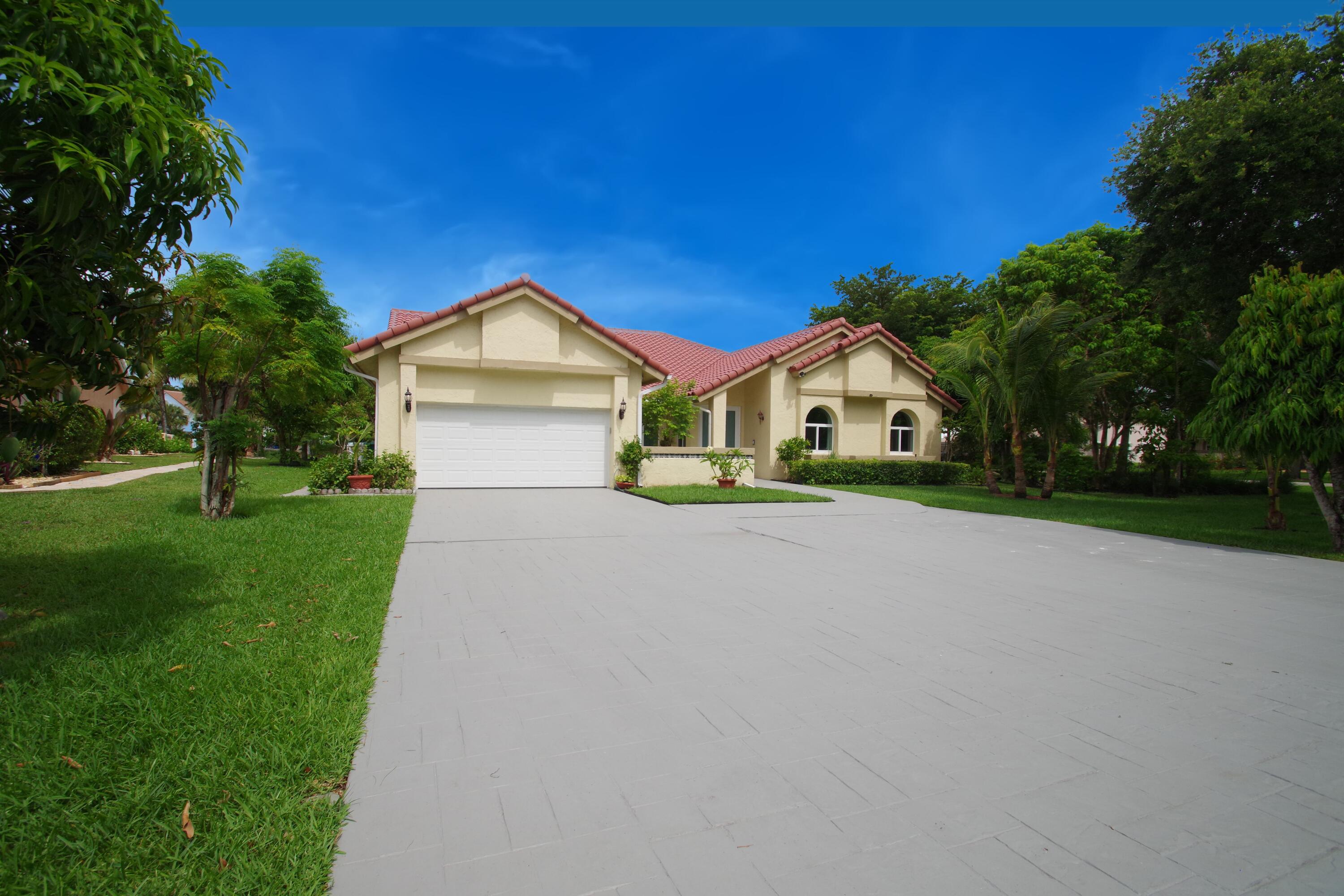 Welcome to this beautifully maintained custom-built 4-bedroom,3-bath, ranch home in one of Parkland's most sought-after gated community of Country Point Estates, situated on an oversized, private 15590 sq ft cul-de-sac corner lot, outdoor oasis features a sparkling pool, lush tropical landscaping, mature, rare fruit trees (mango,sapota,sugar-apple, strawberry-guava and more) Inside soaring celings,bright skylights, and a seamless open-concept floor plan create an inviting atmosphere. Spacious primary suite and secondary bedrooms all feature generous walk-in-closet, meticulously cared for by its original owners, Updates include full Hurricane impact windows, doors and garage door all in 2017.  New roof in 2015, New dual-zone A/C system replaced in 2020(both air handlers and condensers) Additional highlights 2 car garage with an extended driveway fitting up to six cars. Remarkably low Hoa fees, and access to parklands top-ter A-rated schools .