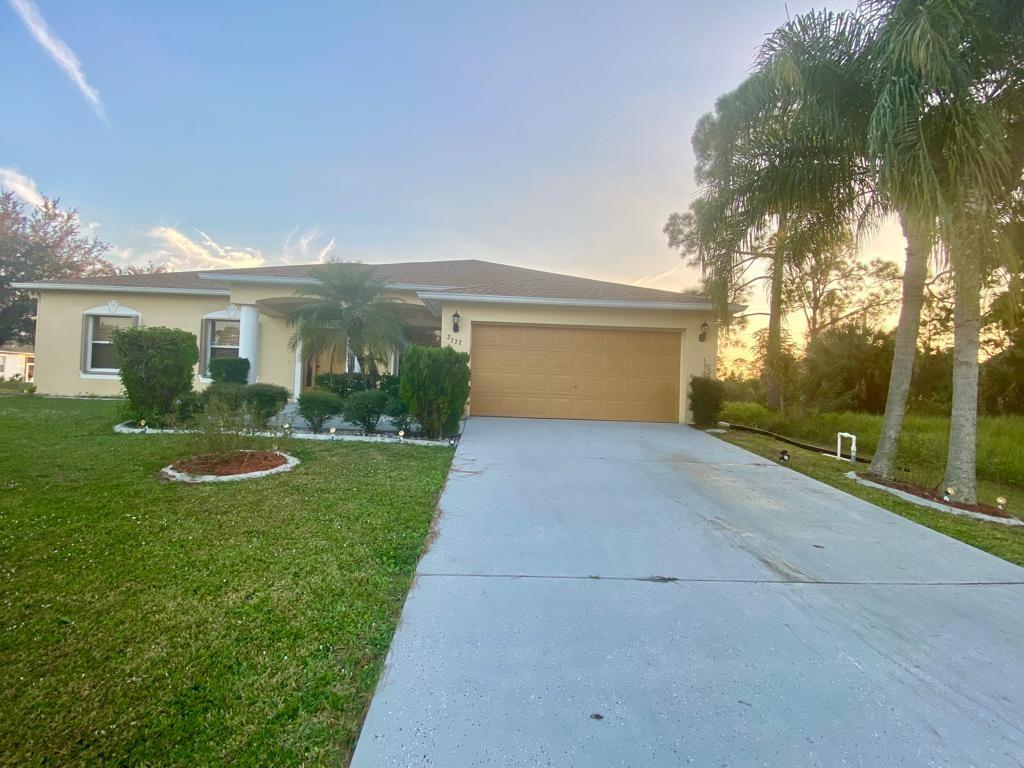 Remarkable house on a Large Corner Lot. 3 bed 2 bath with an extra room for an office or convert to a 4th bedroom. New Hurricane shutters throughout entire windows and doors. Roof installed in 2017. New Water Heater. A/C was installed in 2015. New Laminate floors though out the Entire house. New Kitchen with granite counter tops. Enclosed back patio with windows. Family room, Living room, dining room, breakfast room. wow lot of room for a large family. A must see.