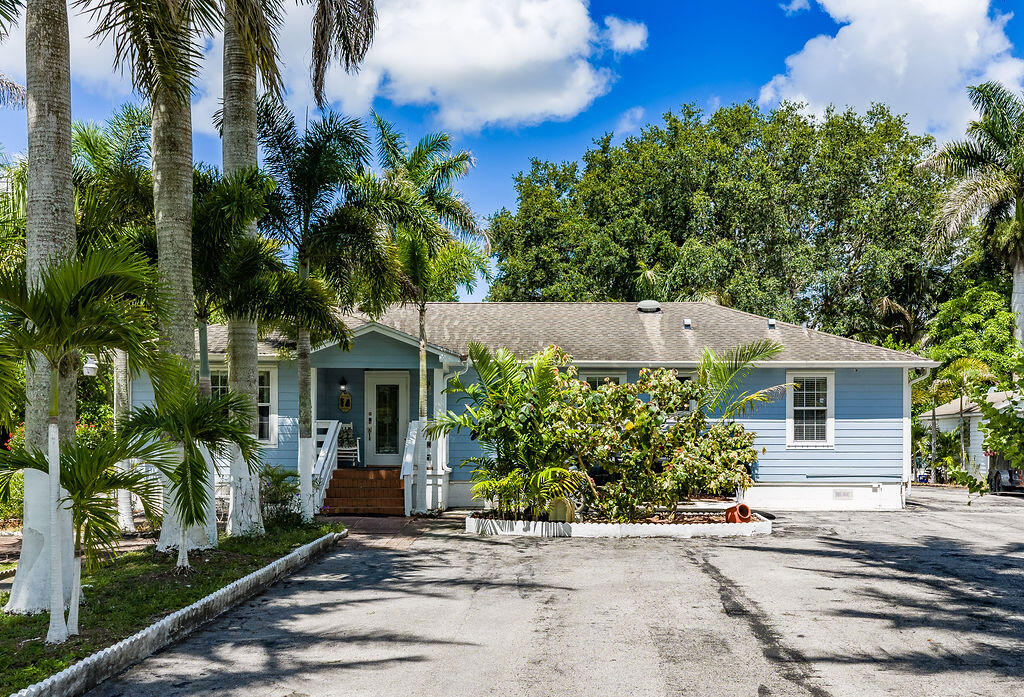 Private Florida Retreat Awaits with NO HOA Space and Privacy come together on a 1.38-acre corner lot. Bring your RV, boat, and all your toys.  Lush mature, tropical landscaping and Royal palms line the property. Paved driveway and road-frontage add both curb appeal and convenience. Generous lot offers space for multiple storage sheds, gardening beds, and endless entertaining possibilities. Hardwood floors and tile throughout.  Natural gas connection for outdoor cooking. Private well paired with a saltwater reverse osmosis system providing total purification right at the tap. With no HOA, this property also presents potential as a short-term rental investment. All of this, just minutes from Wellington's vibrant shopping, dining, and equestrian scene. This is the one you've been waiting for.