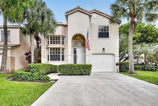 Enjoy South Florida living with this beautifully maintained corner lot home in the heart of Plantation! This 3-bedroom, 2.5-bath home with 1-car garage features separate living, & dining areas with plenty of room for entertaining. The updated kitchen offers stainless steel appliances & plenty of cabinet space. Enjoy peace of mind with a brand-new A/C & water heater (2025) & a newer roof installed just a few years ago. The privately fenced backyard features beautiful landscaping & a screened-in patio perfect for relaxing outdoors. Community amenities include a clubhouse, resort-style heated pool, kiddie pool, spa, outdoor kitchen/barbecue area, & more. Across the street is a park with pickleball and basketball courts, a playground, and a walking path. Make this home yours today!