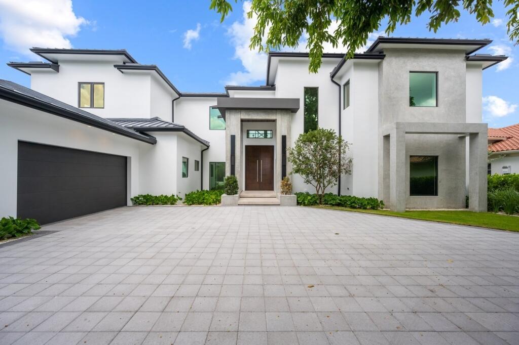 Magnificent custom built new construction home w/the best of everything & stunning river views. This fortress waterfront estate home features 5 bedrooms, 5 full baths and 2 half baths and four car garage. It is beautifully positioned on a 0.79 acres and 100 ft on the water. It features truly unbelievable views of the Loxahatchee River. Green expansive backyard, & covered patio. Privately fenced w/automatic gate. Includes a summer kitchen that overlooks the resort style pool and spa, refurbished dock, lift, ocean access, & beach. Highlights of this waterfront paradise include Hambro System poured cement second floor, hurricane impact windows and doors, formal living room, open plan chef's kit that overlooks the spacious family room, state of the art kitchen equipped w/a large prep island with sink, quartzite and quartz countertops and top-of-the-line Wolf and SubZero stainless steel appliances. It also has a wine cellar opportunity space, game room, bar, theater room, installed WIFI and Sonos and multi room speaker system, large gym-playroom, 2 fully equipped laundry rooms, wood and porcelain tile flooring, custom built cabinetry, signature carpeting, exquisite finishes, light and plumbing fixtures, security system, central vacuum system, elevator shaft, 4 bedrooms with private baths, and a stunning master bedroom suite with a luxurious master bath. Master bedroom also features two large walk-in closets, morning bar, and a breathtaking view balcony.