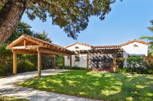Delightful and charming home with 2 bedrooms, 1.5 baths, located in the most wonderfully convenient area with quick access to all your desired spots!  Lovingly cared for and a true treasure.  Barrel tile covered carport, screened porch, pecky cypress arched door, hardwood floors, fireplace, high ceilings, large rooms with great flow, nice kitchen with charming breakfast nook, plus Florida room, office and utility room.  Private back yard with mature landscaping in the heart of West Palm Beach!  Precious home that need just a little TLC to make it home!