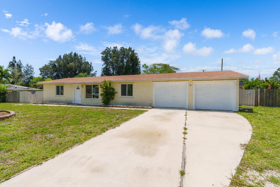 Live your Luxury in Sunny South Florida with the Simple Turn of a Key! A Distinct Opportunity Awaits for First Time Home Buyers, Discerning Investors or Multi-Generational Family Living. Nestled within a NO HOA Community come Enjoy the Freedoms Florida has to Offer. Upon Arrival you'll Notice a Lovely Presentation of Southern Charm. Thoughtfully Upgraded with Impact Windows and Newer Roof. This Ranch Style Home has a Unique Property Arrangement with the Main Home Featuring 3 Bedrooms / 2 Full Baths & Enhanced by Offering An Additional Mother-in-Law Suite/ Studio/ Efficiency with a Kitchenette & 1 Bedroom / 1 Bath. Embrace the Outdoors with your Expansive Land just Shy of Half an Acre. A Bonus Shed and Attached 2 Car Garage sits Ready for an Executive Home Office Suite, Home Gym, or Personalize as Desired. Worry-free with Public Water and Public Sewer. Centrally Located in Palm Springs & Delightfully Minutes from Restaurants, I-95, & Shopping. Capitalize on the Opportune moment for Quick Occupancy. Schedule your Private Tour Today!