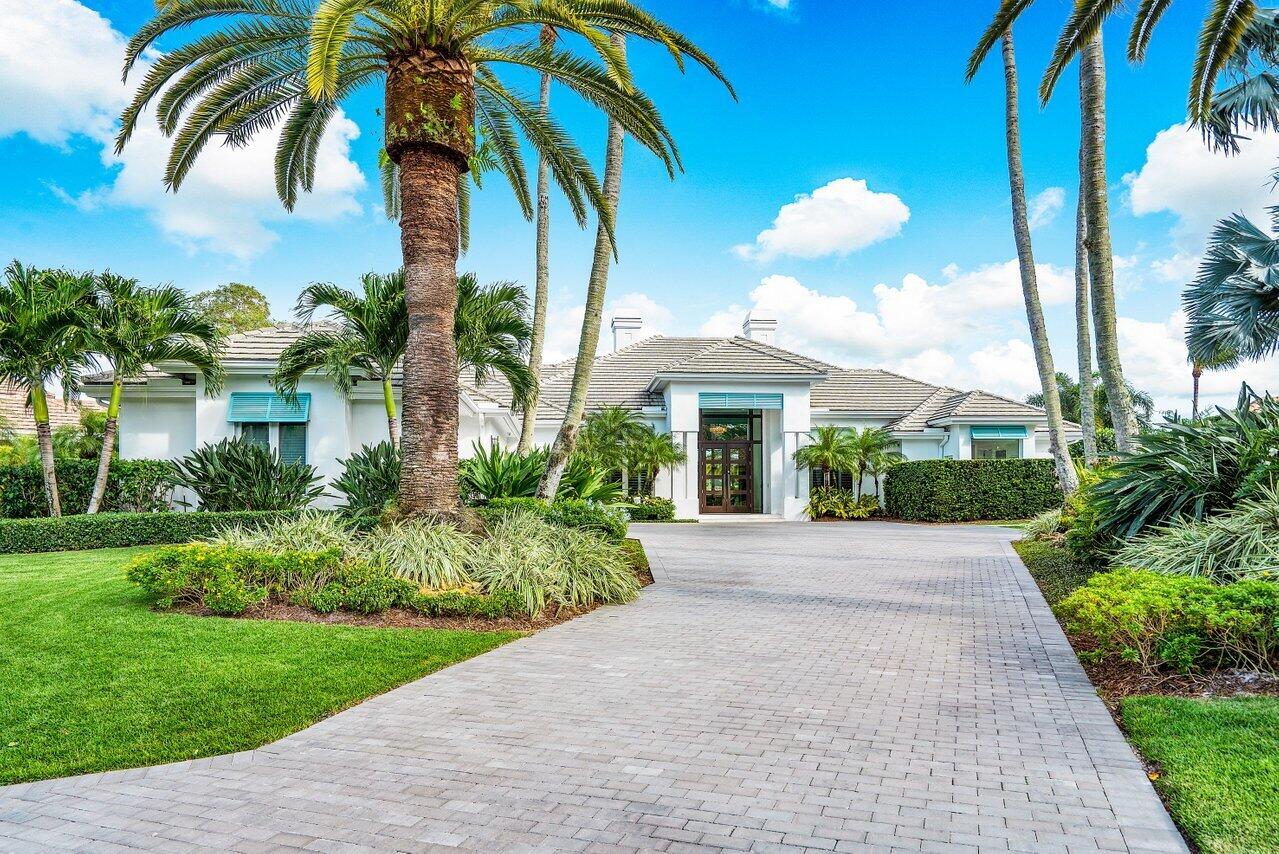 This recently remodeled 5 bedroom, 5 ½ bath home offers 4,701 sq. ft. of luxurious living and exceptional lake and golf course views at The Loxahatchee Club, the premiere golf club community in Jupiter.  Everything about this home welcomes you, from the newly-pavered driveway flanked by date palms and lush landscaping, to the custom wood and glass entry door leading to a foyer that immediately presents you with striking views of the lake and golf course through window walls of glass in the great room, which itself boasts a new and cozy fireplace. The kitchen, the heart of this home, offers an abundance of custom cabinetry and adorned Quartzsite custom countertops, as well as magnificent views of the golf course. The owner's suite boasts two large walk-in closets, one with a safe room with access to all the security cameras on the property, and his and her own master baths. Hers is white diamond Maribel throughout with a floating tub and walk-through shower along with a water closet and a bidet.  All 5 bedrooms have their own ensuite baths.  A covered lanai with retractable screens and summer kitchen flank the pool deck and guest house.  A custom putting green beyond the pool offers hours of practice and enjoyment, while a lush garden near two fruit trees lets you grow your own delicious vegetables.  A large laundry with a custom wall-hung ironing board and a two-car plus golf cart garage completes this perfectly equipped home. 

The ultimate in Florida living!