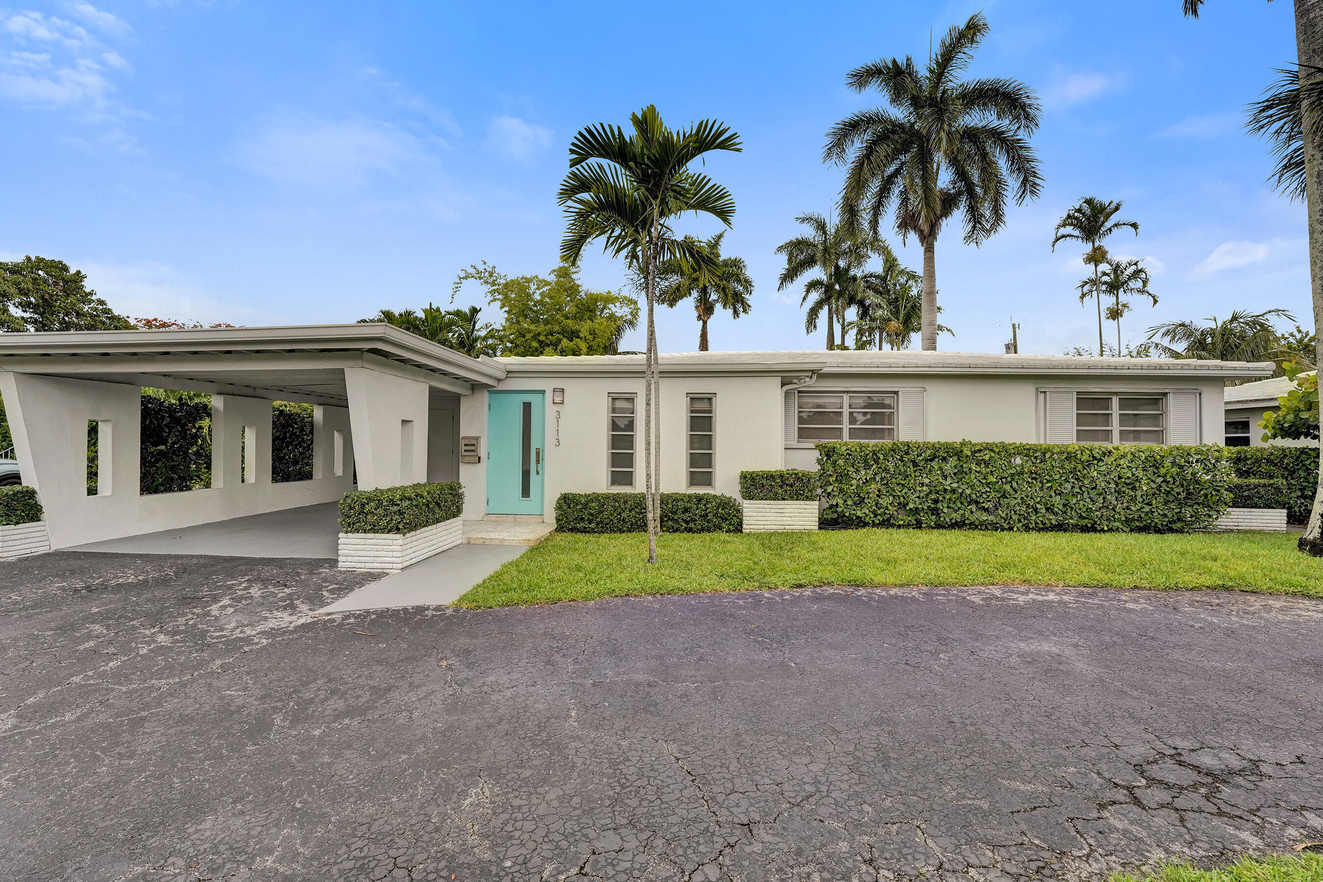 Welcome to this original mid century modern, 3 bed, 2 bath single-family residence located in Central Hollywood. This home offers 1,996 square feet of finished living space, providing an efficient and comfortable layout. Situated in an established community, this property presents an excellent opportunity for those seeking a home near all conveniences. Home is accessible to tri-rail station, highways, beaches, golf courses, hard rock casino, hospital and downtown. Home features terrazo flooring, 2019 AC unit, concrete tile roof, gutters, plastered walls and ceiling, 3 zone sprinkler system, gas fireplace, mature landscaping, freshly painted interior, granite countertops, shutters, electrical panels updated 2006 and alley access. Make this home yours today. Call to see in person.