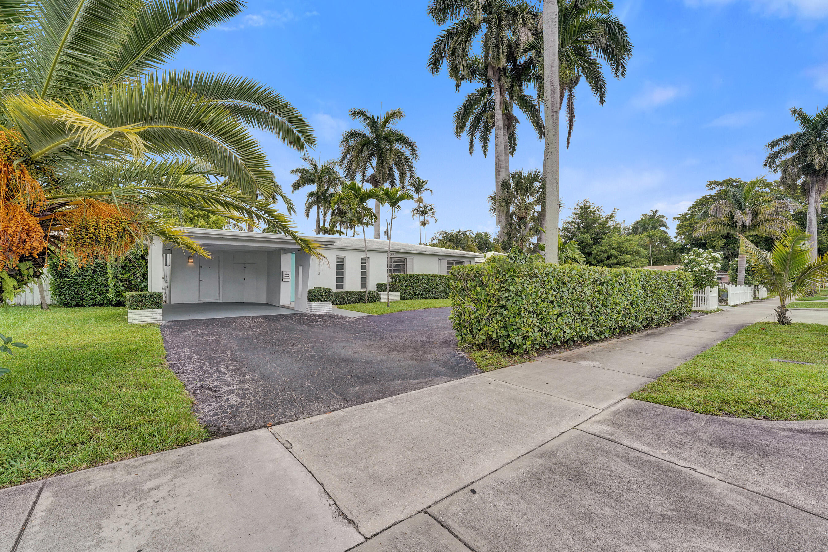 Welcome to this original mid century modern, 3 bed, 2 bath single-family residence located in Central Hollywood. This home offers 1,996 square feet of finished living space, providing an efficient and comfortable layout. Situated in an established community, this property presents an excellent opportunity for those seeking a home near all conveniences. Home is accessible to tri-rail station, highways, beaches, golf courses, hard rock casino, hospital and downtown. Home features terrazo flooring, 2019 AC unit, concrete tile roof, gutters, plastered walls and ceiling, 3 zone sprinkler system, gas fireplace, mature landscaping, freshly painted interior, granite countertops, shutters, electrical panels updated 2006 and alley access. Make this home yours today. Call to see in person.