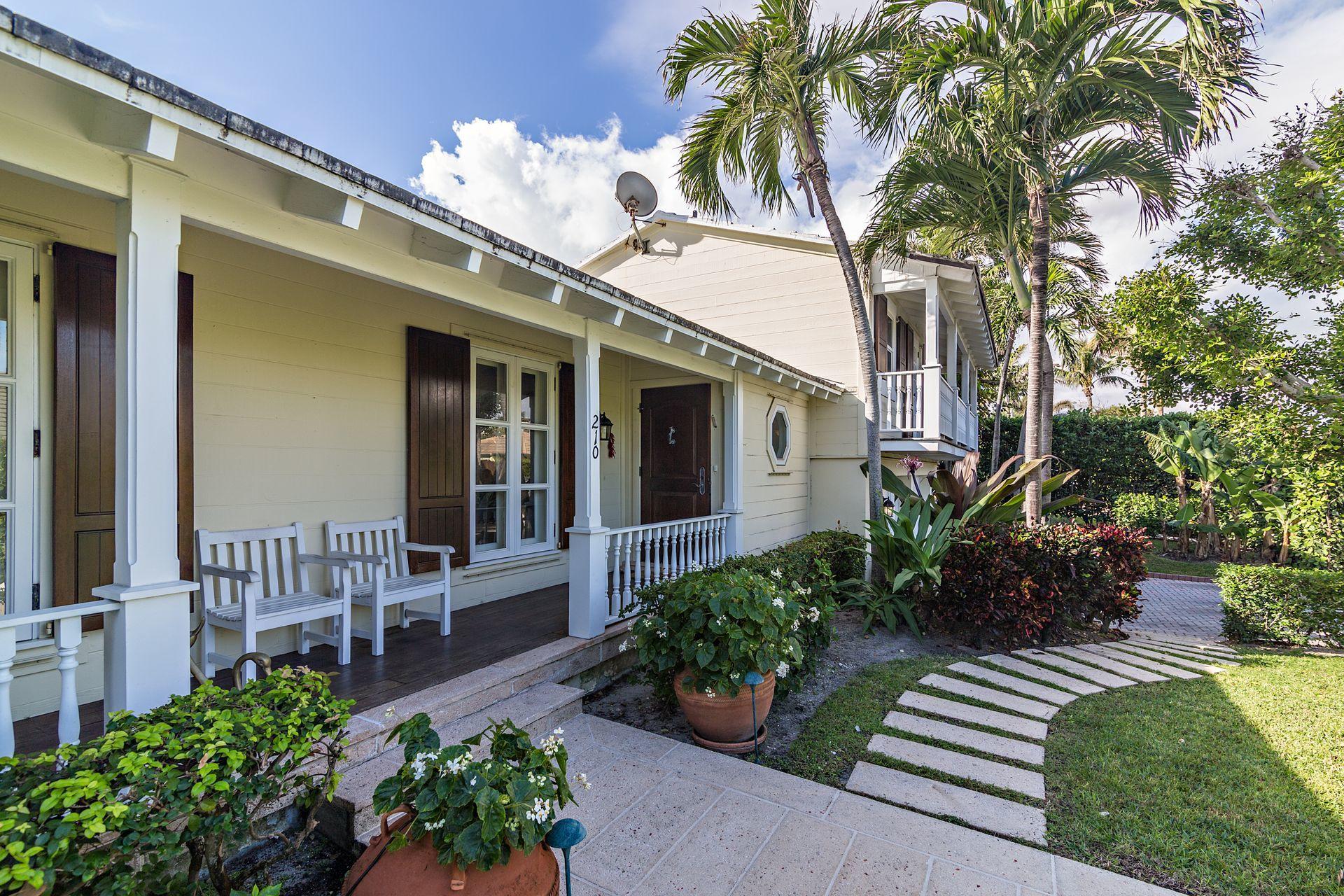 Expansive 4 Bedroom, 4 Bathroom Home with separate 1BR/1BA Guest Cottage on idyllic North End Street. Located on an over 10,000 square foot lot, the residence boasts a covered porch entry, large rooms brimming with natural light, partial impact glass, and a private Master suite. The property offers a two-car garage, heated salt-water lap pool, full-house generator, buried utility lines, and private access to the beach & beach cabana.