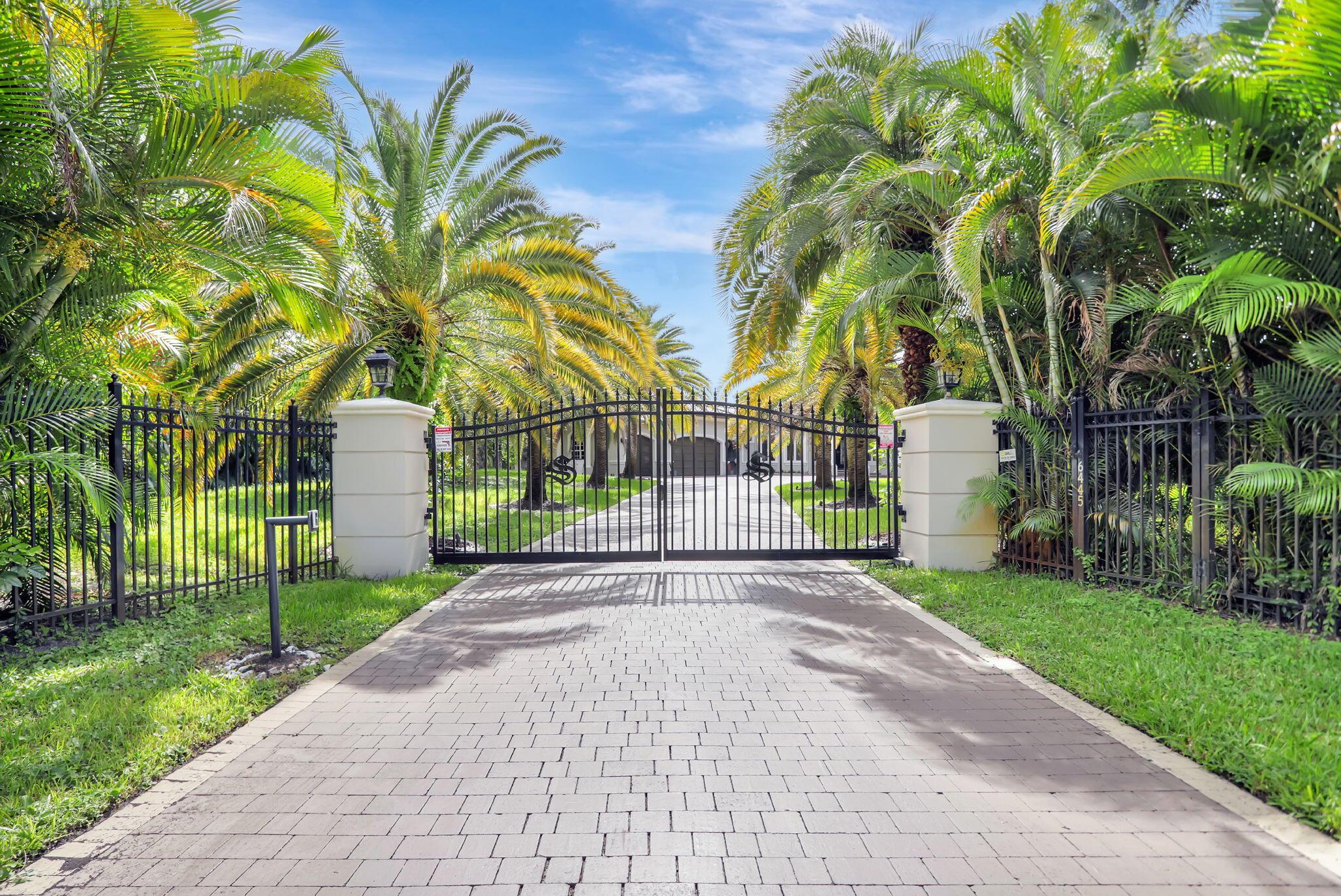 EQUESTRIAN LOVERS PARKLAND FL DREAM ESTATE - Property is approx 3 manicured acres completely surrounded by 25' high eureka palms for absolut 100% privacy from your neighbors and the street. Over a dozen mature fruit trees and multiple garden beds for the ultimate hobby farm luxury lifestyle. ''Paddock Paradise'' Custom designed equestrian farm with multiple water and feed stations around the paddock paradise track system designed to keep the horses moving, healthy and happy. Main barn has 5 large stalls run in style, 3 stalls side barn, with a custom built goat house that can hold a dozen goats can also be transitioned into 3 more horse stalls if desired.  AC tack room and feed room, bathroom, washer dryer and oversized sink to accommodate. CONTINUE..... Separate hay room and chicken coop, 50' round pen, 175' x 80' custom built riding arena with built in french drains and 8" of high quality footing to ensure the best riding experiences. This unique property is one of a kind, the owner purchased the 2 lots behind the main estate and purchased the utility easement from the city of Parkland and lobbied to have all the lots joined to create one large uninterrupted track of land. It's the Only property in Pine Tree Estates Parkland Florida that has fully secured gated entrances on two streets. The main estate gated entrance is 6445 NW 75th way and the back equestrian property gated entrance is 6448 NW 77th Terr.  "please see pictures to fully understand the magnitude of this one of a kind property.  Note: The 3 lots can be separated and 2 homes can be built on the back 2 lots if desired. 

The custom built courtyard style home with 7058 sq. ft under roof. 5 large bedrooms, 4 full baths, steam shower, gym, office, Jack and Jill bedrooms have a bonus area owner used as a classroom to tutor their children. Marble and Hardwood floors throughout - No Carpet. Genrac whole house 32,000 kw generator, 1000 gallon LP tank to for power for up to a month if needed, Custom Chef's Kitchen, Gas 8 burner Thermodor stove with griddle, Double oven, Kitchen island with separate sink, Estate has a magnificent 42,000 gallon resort style custom built salt water pool with a 10,000 gallon raised hot tub spa with dozens of jets and seating for 20 people. Home was completely remodeled in 2020 with no expense spared as you can see from the pictures. Home has a 4 car XL garage with a drive on car lift garage that can hold 5 cars. With an oversized 5th garage door on the back side of the garage with access to a large concrete area that was used as a basketball court. The rear of the house has a 5th garage to store your lawn equipment. Estate has a top of the line commercial grade R/O reverse osmosis system to provide the entire estate with high quality water with a TDS in the single digits. Commercial grade central vacuum system, LED lighting, security cameras, Grand gated entry, estate has been freshly painted and is move-in ready. Oversized driveway with drive up overhang can hold over 20 cars. Luxury Equestrian Estate Living at its finest!!!
...CHANDELIER AT LIVING ROOM DOES NOT CONVEY...