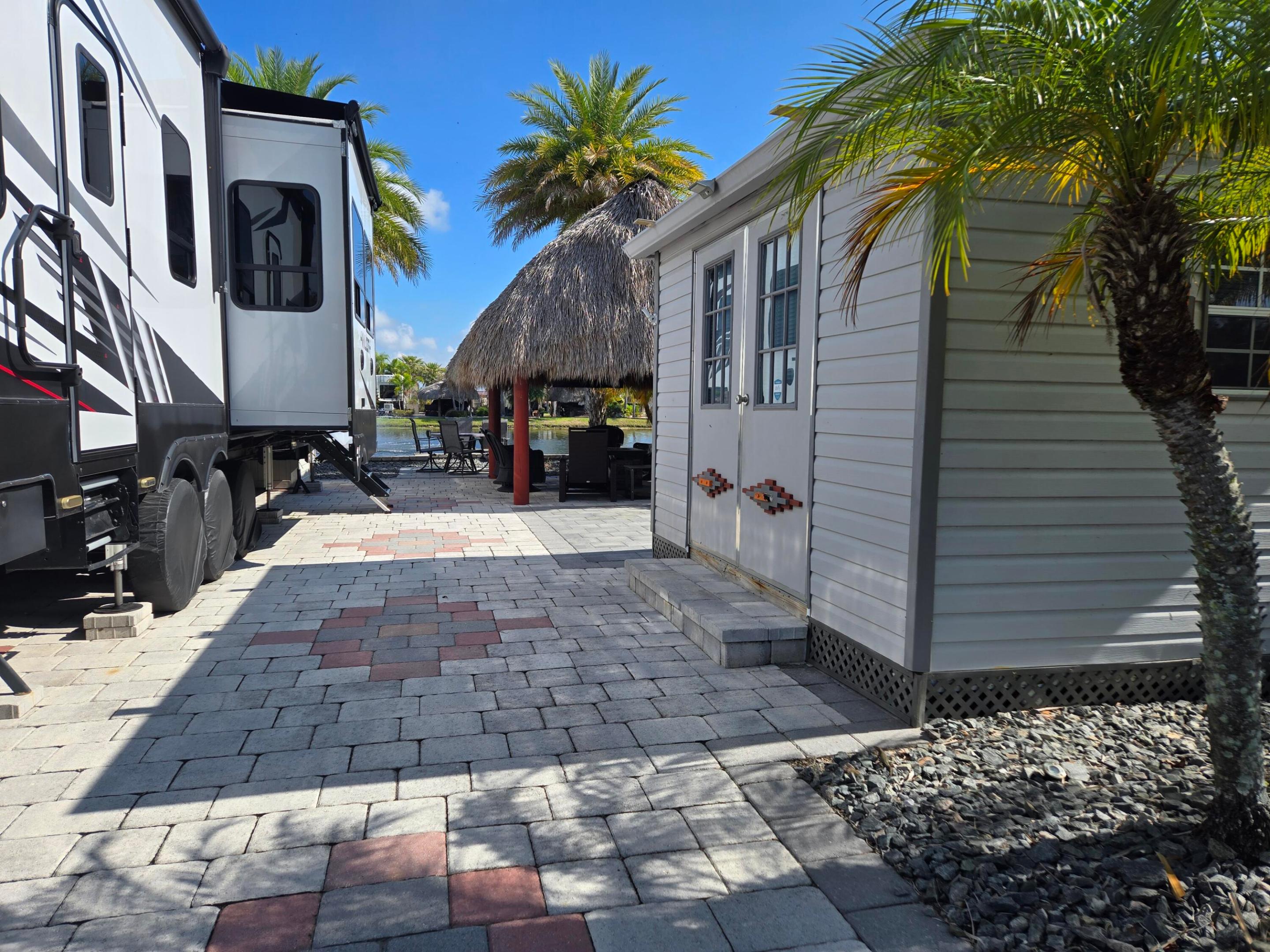 Beautiful lake lot, finished casita, tiki overlooking lake, Enjoy the sounds of the fountain. Clubhouse with daily activities. Bar and grill, dog park, pickleball and so much more awaits you at this 5 star . resort. Fully deeded lot ownership. Full time or seasonal use.
