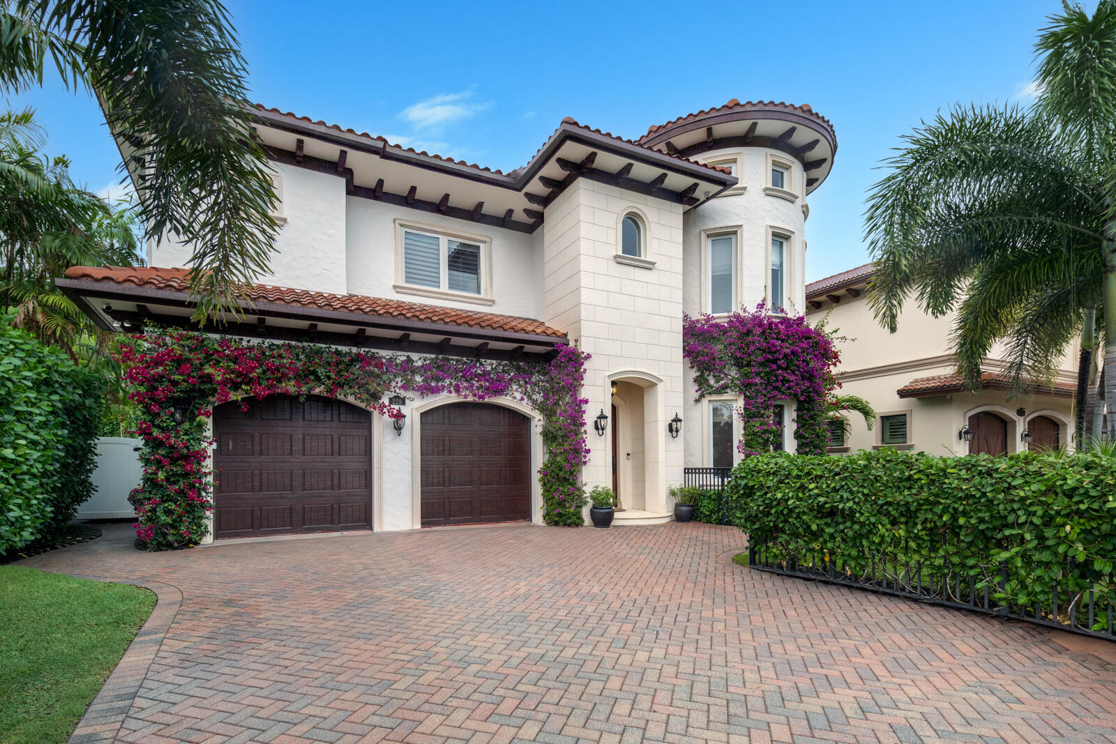 Located in SoSo, a coveted area of West Palm Beach, this Mediterranean-style residence offers five bedrooms, four full bathrooms, and 4,225± total square feet of thoughtfully designed living space.  A foyer hall leads into the main living areas of the home. The kitchen is well-appointed for both everyday living and entertaining, featuring a breakfast nook, wine refrigerator, Thermador gas range with oven, additional wall oven, microwave, JennAir refrigerator and freezer, Bosch dishwasher, and a spacious walk-in pantry. The kitchen seamlessly connects to the dining area and living spaces. The living room provides direct access to the covered patio and pool. A first-floor bedroom with a full bathroom offers flexible space for guests or a home office.  Upstairs, the  primary suite serves as a private retreat, complete with dual sinks, a separate soaking tub and walk-in shower, a generous walk-in closet, and plantation shutters. Three additional bedrooms are located on the second floor, including one with an oversized walk-in closet. A shared bathroom with dual sinks serves two of the bedrooms, while another bedroom features its own en suite bathroom. The laundry room is also conveniently located on the second floor.  The outdoor area includes a pool, covered patio with space for lounging and dining, and a built-in BBQ, creating an ideal setting for outdoor entertaining.  Additional features include full hurricane-impact windows and doors, a full-house generator, 10-foot ceilings, and a two-car garage with an additional refrigerator and freezer for extra storage. Ideally located with convenient access to the Intracoastal bike path.