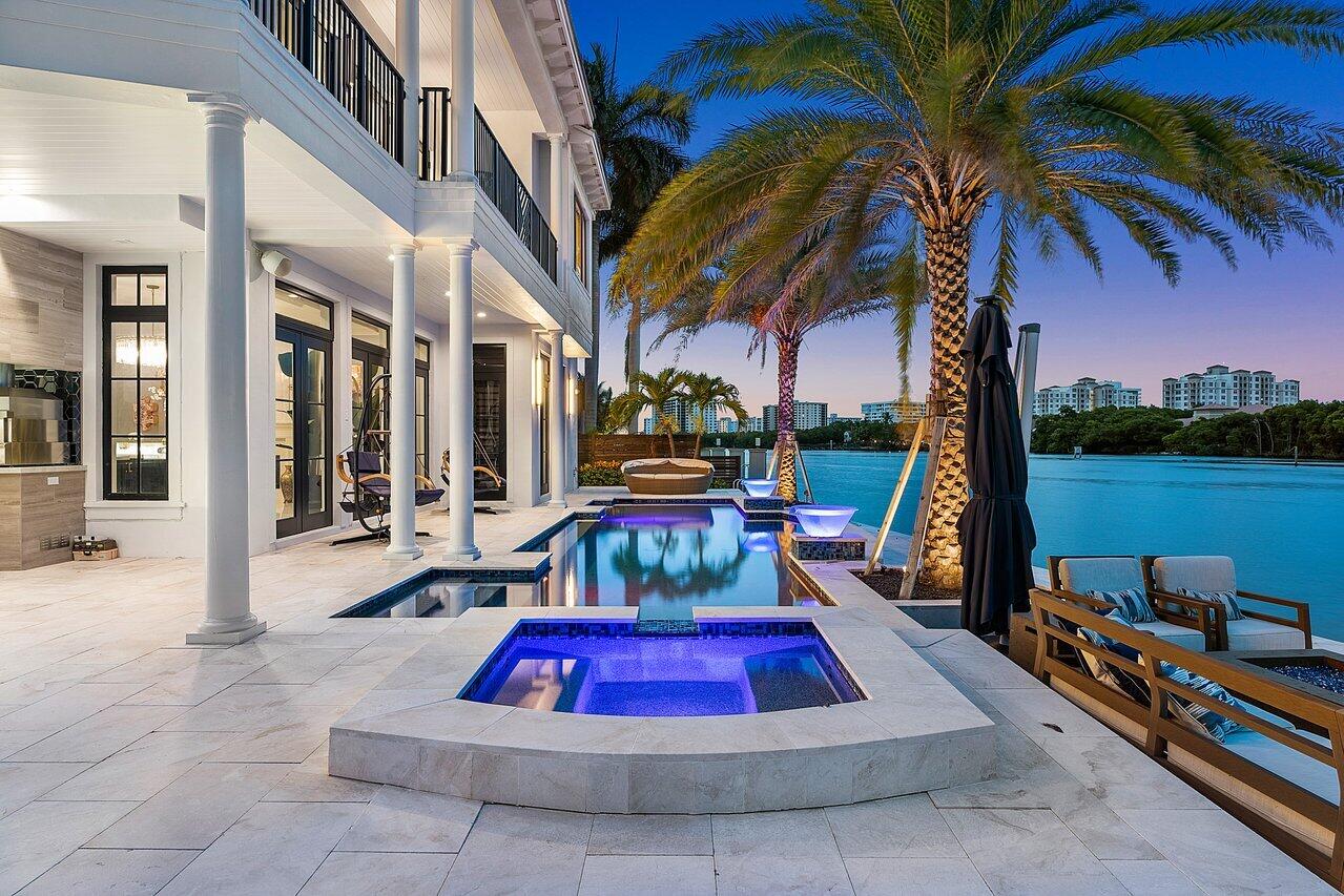 This exclusive waterfront estate in Boca Raton epitomizes the pinnacle of luxury living in South Florida. Recently reduced by over $1,500,000.00, this remarkable property now stands as one of the most extraordinary waterfront values in Palm Beach County, offering unparalleled elegance and sophistication. Nestled on a double point lot with an impressive 260 feet of prime waterfrontage, this home provides unparalleled views of the sparkling Intracoastal Waterway that will take your breath away. Meticulously renovated with over $1.5 million in recent updates, this residence boasts an array of top-of-the-line features and amenities that cater to the most discerning of tastes. Boating enthusiasts will delight in the convenience of a 27,000-pound boat lift capable of accommodating up a 40 foot vessel, as well as a dock capable of hosting an 80-foot boat.

The interior of this magnificent residence is equally impressive, with an elevator providing easy access to all levels, a smart home automation system for modern convenience, and opulent finishes throughout. The expansive outdoor living space offers a reinforced seawall, a saltwater pool, a sunken fire pit, a custom outdoor kitchen, and a commercial grade al fresco pizza oven, making it an ideal setting for entertaining or simply unwinding in the ultimate luxury.

Other notable features of this estate include a full home theater, an 800-pound custom chandelier, a Viking/Sub-Zero gourmet kitchen, and an abundance of custom millwork that adds an exquisite touch of timeless elegance. Ideally situated in Palm Beach County, this exceptional property is just moments away from world-class shopping, dining, and entertainment options, further enhancing the allure of this extraordinary residence. Embodying the essence of waterfront living at its finest, this is truly an unparalleled opportunity to experience the epitome of luxury living in South Florida.