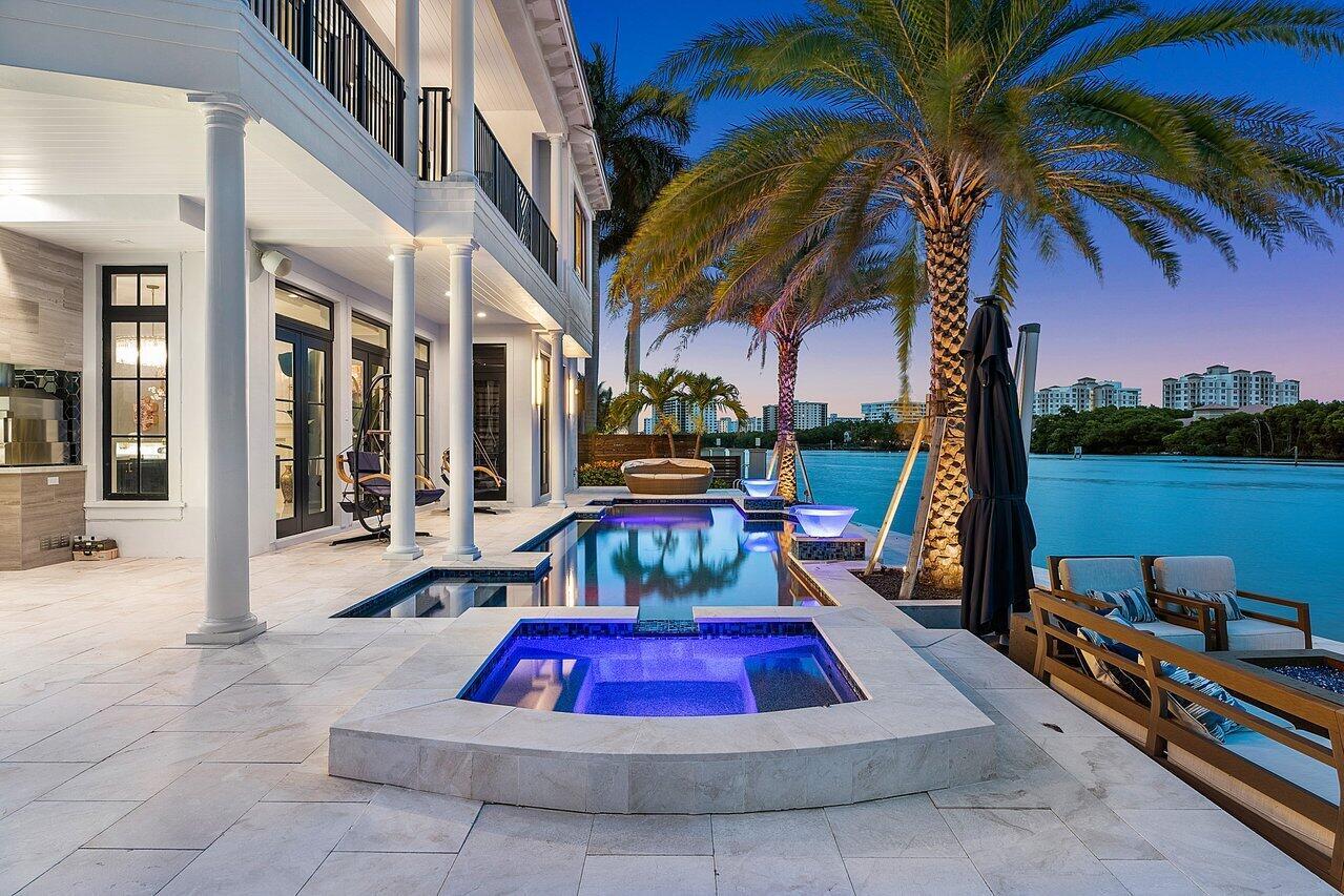 This exclusive waterfront estate in Boca Raton epitomizes the pinnacle of luxury living in South Florida. Recently reduced by over $1,500,000.00, this remarkable property now stands as one of the most extraordinary waterfront values in Palm Beach County, offering unparalleled elegance and sophistication. Nestled on a double point lot with an impressive 260 feet of prime waterfrontage, this home provides unparalleled views of the sparkling Intracoastal Waterway that will take your breath away. Meticulously renovated with over $1.5 million in recent updates, this residence boasts an array of top-of-the-line features and amenities that cater to the most discerning of tastes. Boating enthusiasts will delight in the convenience of a 27,000-pound boat lift capable of accommodating up a 40 foot vessel, as well as a dock capable of hosting an 80-foot boat.

The interior of this magnificent residence is equally impressive, with an elevator providing easy access to all levels, a smart home automation system for modern convenience, and opulent finishes throughout. The expansive outdoor living space offers a reinforced seawall, a saltwater pool, a sunken fire pit, a custom outdoor kitchen, and a commercial grade al fresco pizza oven, making it an ideal setting for entertaining or simply unwinding in the ultimate luxury.

Other notable features of this estate include a full home theater, an 800-pound custom chandelier, a Viking/Sub-Zero gourmet kitchen, and an abundance of custom millwork that adds an exquisite touch of timeless elegance. Ideally situated in Palm Beach County, this exceptional property is just moments away from world-class shopping, dining, and entertainment options, further enhancing the allure of this extraordinary residence. Embodying the essence of waterfront living at its finest, this is truly an unparalleled opportunity to experience the epitome of luxury living in South Florida.