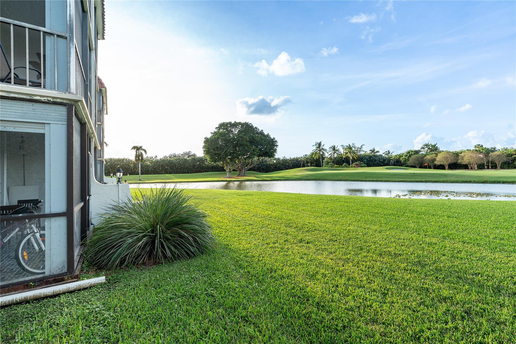 LOCATION! LOCATION! LOCATION! Enjoy your morning coffee and/or evening cheer overlooking EXPANSIVE LAKE/PGA 10TH FAIRWAY-GREEN VIEWS! Convenient 1st Floor! North/South Exposure. 2BR/2BA (1,170SF). Fully Furnished. 2 large walk-in closets. Clean and comfortable. Recreation Lease PAID IN FULL! FREE golf (except cart fees) on two 18 hole courses (PGA & Par3); Amenities include Restaurant, Billiard Room, Bbq/Picnic Area, Clubhouse, Courtesy Bus, Exercise Room, Heated Pool, Library, Putting Green, Sauna, Shuffleboard, Tennis, Pickle Ball, Vehicle Wash Area, Electric Car Charging Station. Close to shopping, dining & highways. 15 min. to beach. Association says 55+ age required;  GREAT OPPORTUNITY!!!