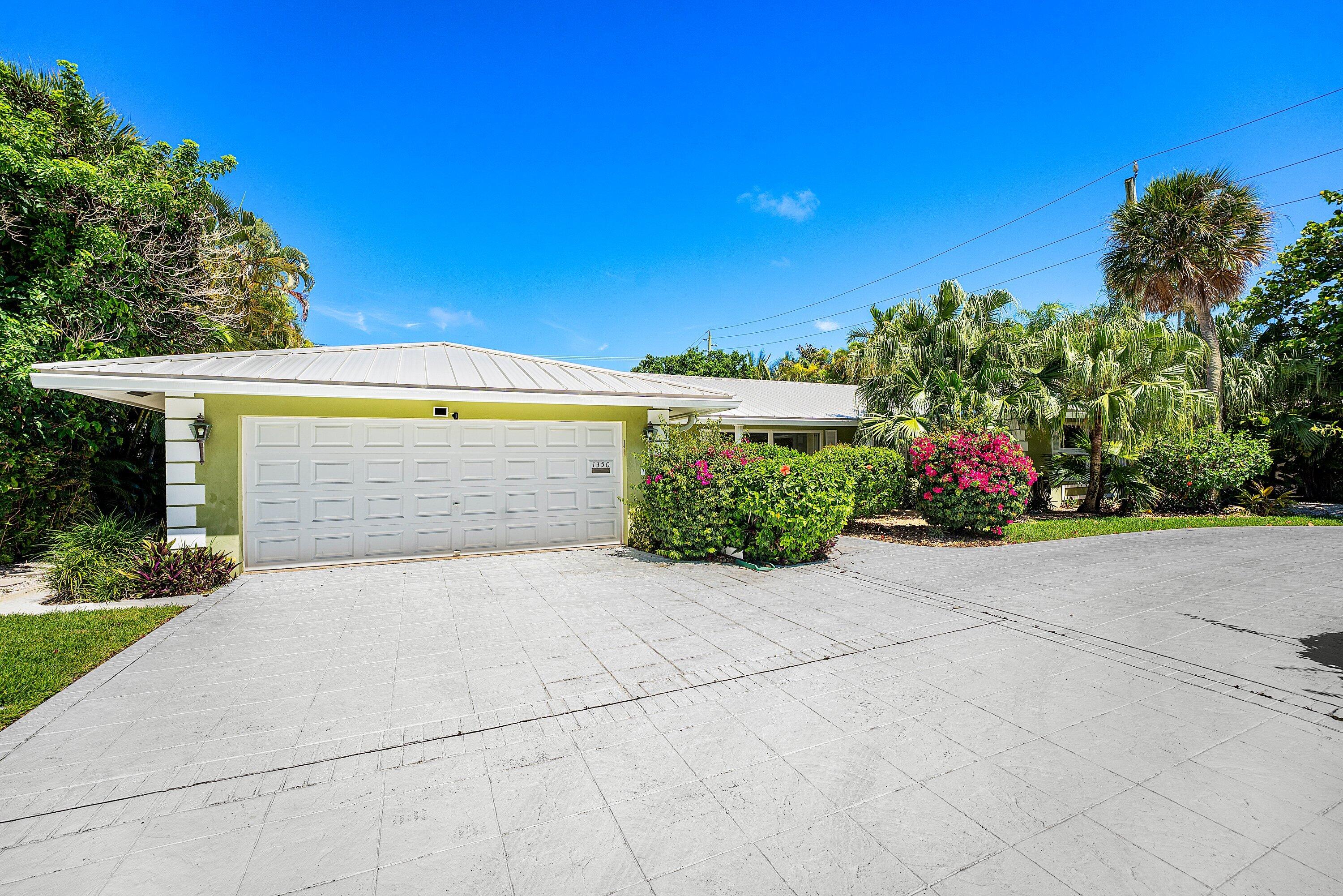 Available June 1st through the end of the year with flexible lease terms and month to month options available. Indulge in the timeless Old Palm Beach lifestyle just 3 blocks from the beach in prestigious Spanish River Land Estates. Situated on over 1/3 acre of lush, manicured grounds, this private estate offers 3 bedrooms, 3.5 bathrooms, and an exceptional indoor-outdoor living experience. Features include a circular driveway, new metal roof, and high impact fully retractable doors that seamlessly open to the tropical outdoor setting.
