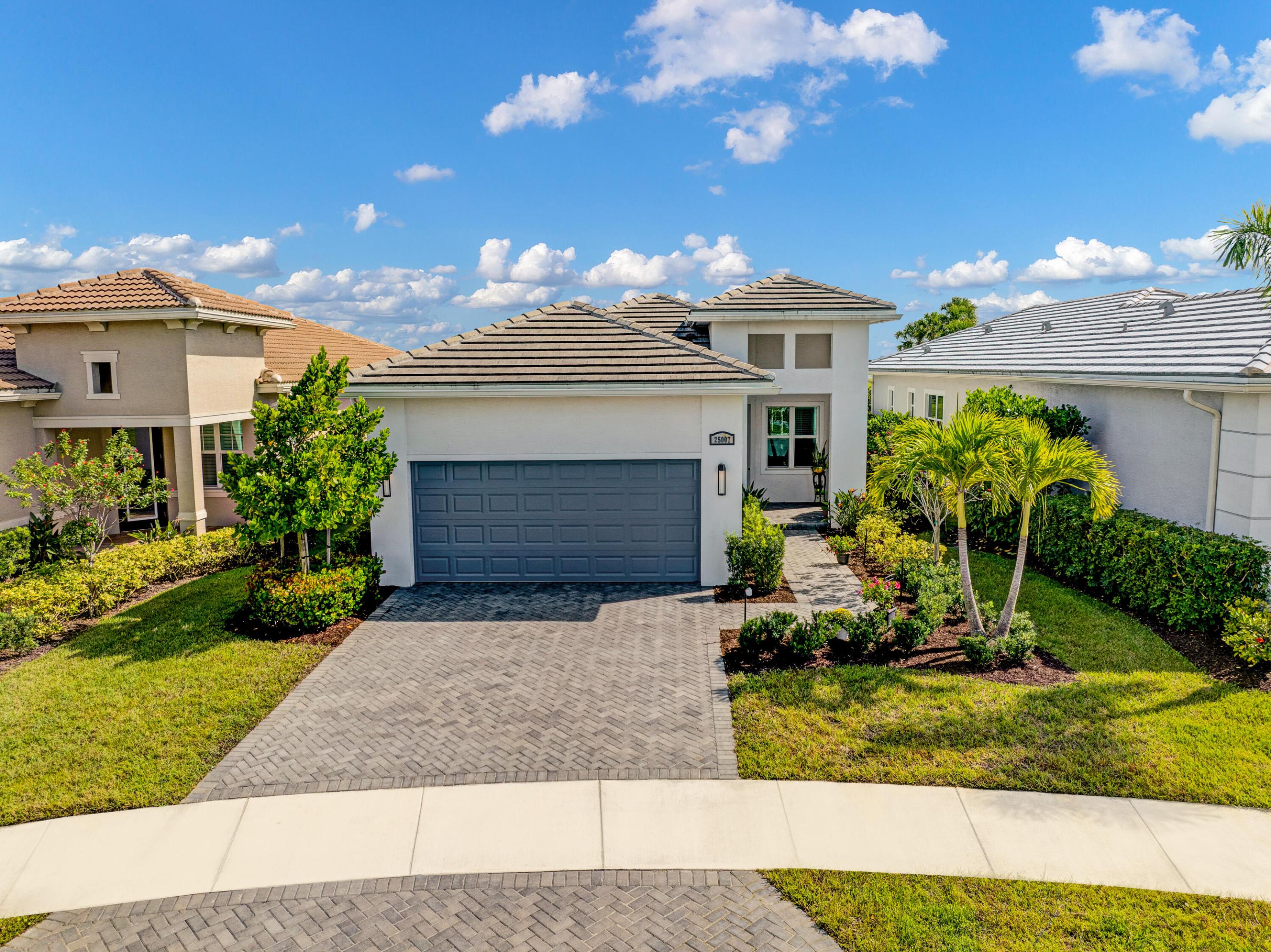 Enjoy lake views from your screened back patio on a quiet culs de sac! This pristine Bella model has both! Its lake front location on a peaceful street provides the perfect setting to spend relaxing evenings. This spacious home, with high ceilings & 8' doors, features 2 bedrooms plus a 3rd bedroom/flex room with french doors. Main living area is tiled throughout with a coffered ceiling in the living room. Eat in kitchen has wood cabinets, granite countertops, stainless appliances, & snack bar counter. Master suite includes another coffer, 2 walk-in closets & bath with dual sinks & floor to ceiling tiles in the shower. Windows are impact resistant with white cordless blinds. Garage floor has industrial epoxy coating. Seller offering $5000 toward closing costs/interest rate buy down. Plus... PGA Verano has it all! There are an abundance of activities at the Club Talavera clubhouse with billiards, card rooms, a library, and various clubs and activities. There are 3 pools including a resort style pool, a resistance pool, and an indoor pool. There are also 3 fitness centers including a smartFIT training center and group fitness classes, plus a spa and wellness center. Outdoor activities include tennis, pickle ball, bocce, basketball, a tot playground, and optional golf membership. Shopping, restaurants, beautiful Florida beaches, and major highways are all nearby.