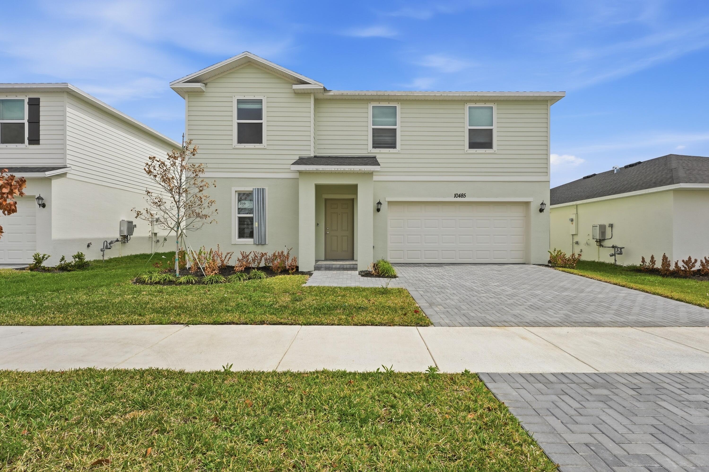 The first floor of this two-story home shares an open layout between the kitchen, dining area and family room with access to the patio. A secondary bedroom on the first floor can easily be converted to a guest room or home office. Upstairs is a versatile loft that serves as an additional shared living space, along with three secondary bedrooms and a luxe owner's suite comprised of an en-suite bathroom and a large walk-in closet.