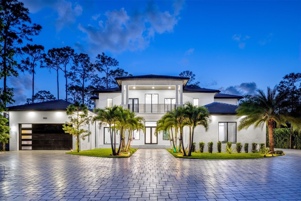 Experience refined living in this meticulously crafted, gated luxury estate, in the heart of Parkland. Nestled amid mature trees & lush greenery, this modern masterpiece offers the perfect blend of elegance, comfort, and contemporary design. Boasting 6BD/5.5BA across 7400+SF of open-concept living, this home is filled with upscale finishes — from soaring ceilings & oversized windows, to imported porcelain flooring and designer lighting. The gourmet kitchen features custom cabinetry, quartzite countertops, a sprawling island, & premium appliances.  Located within top-rated schools, walking trails, and nearby parks, this home offers both tranquility and convenience. Parkland is known for its family-friendly lifestyle, equestrian roots, proximity to first rate schools, fine dining & shopping.
