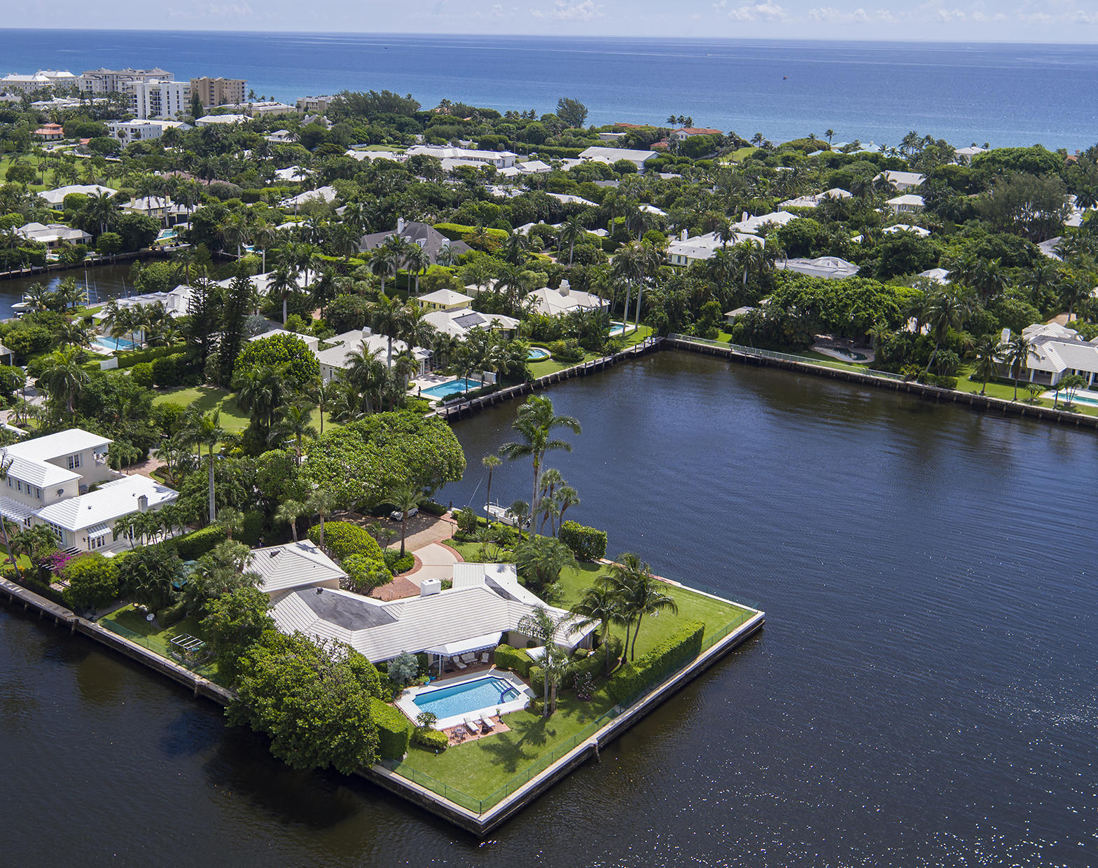 PARK YOUR YACHT HERE, YACHTSMEN'S PARADISE, PROTECTIVE COVE, TRIPLE POINT LOT. ONE OF GULF STREAM'S FINEST WATERFRONT LOTS.  WATER ON THREE SIDES, TOTAL OF 530 FT.+/- WATERFRONTAGE. SUPER DOCKAGE. HOME USES PRIVATE SEWER SYSTEM. ***SEE SUPPLEMENT*** Surrounded by water on three sides, this rare double-point estate features a grand total of 530ï¿½ feet of shoreline which fronts the Intracoastal Waterway and famous Polo Cove, giving unobstructed panoramic water views stretching from the west to the south and east.  A winding drive leads to a circular motor court in front of the residence on expansive lawns with lush, established tropical trees and plantings.  By the sun-splashed pool, the lounge terrace takes in the sweeping water view of the island-like setting.  The cove frontage is equipped with boat dockage.


Disclaimer: The information provided herein including but not limited to prices, measurements, square footages, lot sizes, calculations and statistics have been obtained and conveyed from third parties such as the applicable Multiple Listing Service, public records as well as other sources. All information including that produced by the Sellers or Listing Company are subject to errors, omissions or changes without notice and should be independently verified by any prospect for the purchase of a Property.  The Sellers and Listing Company expressly disclaim any warranty or representation regarding all enclosed information.  Prospects' use of any information herein is acknowledgement of this disclaimer and that Prospect shall perform their own due diligence.  Prospects shall not rely on this information when entering into a contract for sale and purchase.  Some affiliations may not be applicable to certain geographic areas. If your property is currently listed, please do not consider this a solicitation.   In the event a Buyer defaults, no commission will be paid to either Broker on the Deposits retained by the Seller. "No Commissions Paid until Title Passes."    Buyer pays title insurance, Florida documentary stamps, and all other closing costs for New Construction and land use. Copyright 2016 Listing Company.  All Rights Reserved.