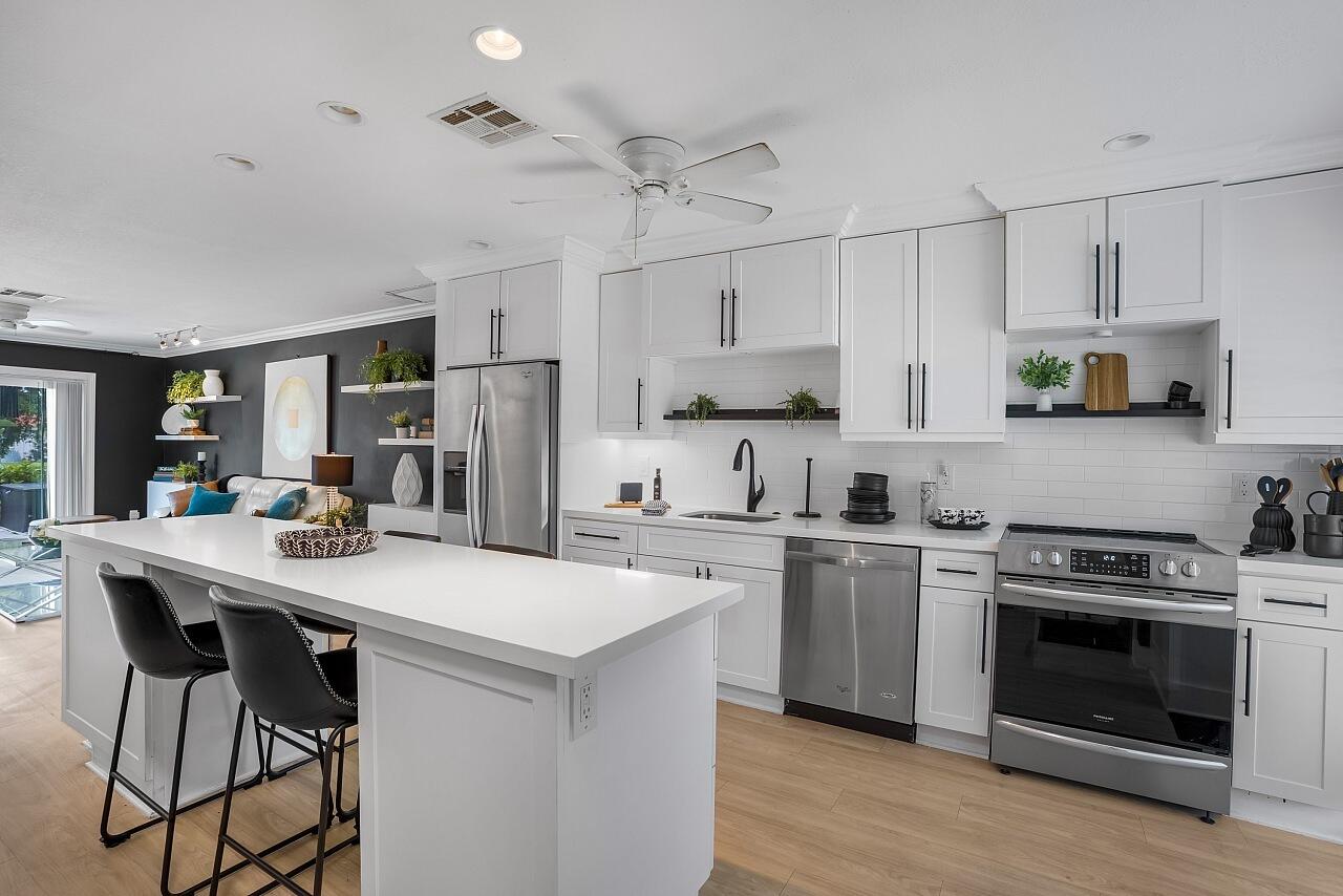 Beautifully remodeled with style and function in mind, this 2Bed/2Bath villa is located in the gated 55+ community of Boca Lakes. This single-level condo is fully furnished & features an updated kitchen with quartz countertops, a large island, stainless steel appliances, light wood-look flooring, & crown molding throughout. Thoughtful upgrades include remodeled bathrooms with floating vanities, hurricane-impact windows/doors, an in-unit washer/dryer combo & a newer roof. The primary suite features a roll-in shower for added convenience. Assigned parking is located directly in front of the unit, with plenty of guest parking nearby. The HOA includes cable, Internet, water, sewer, roof maintenance &landscaping. Enjoy resort-style amenities, clubhouse, pool, tennis & social activities!