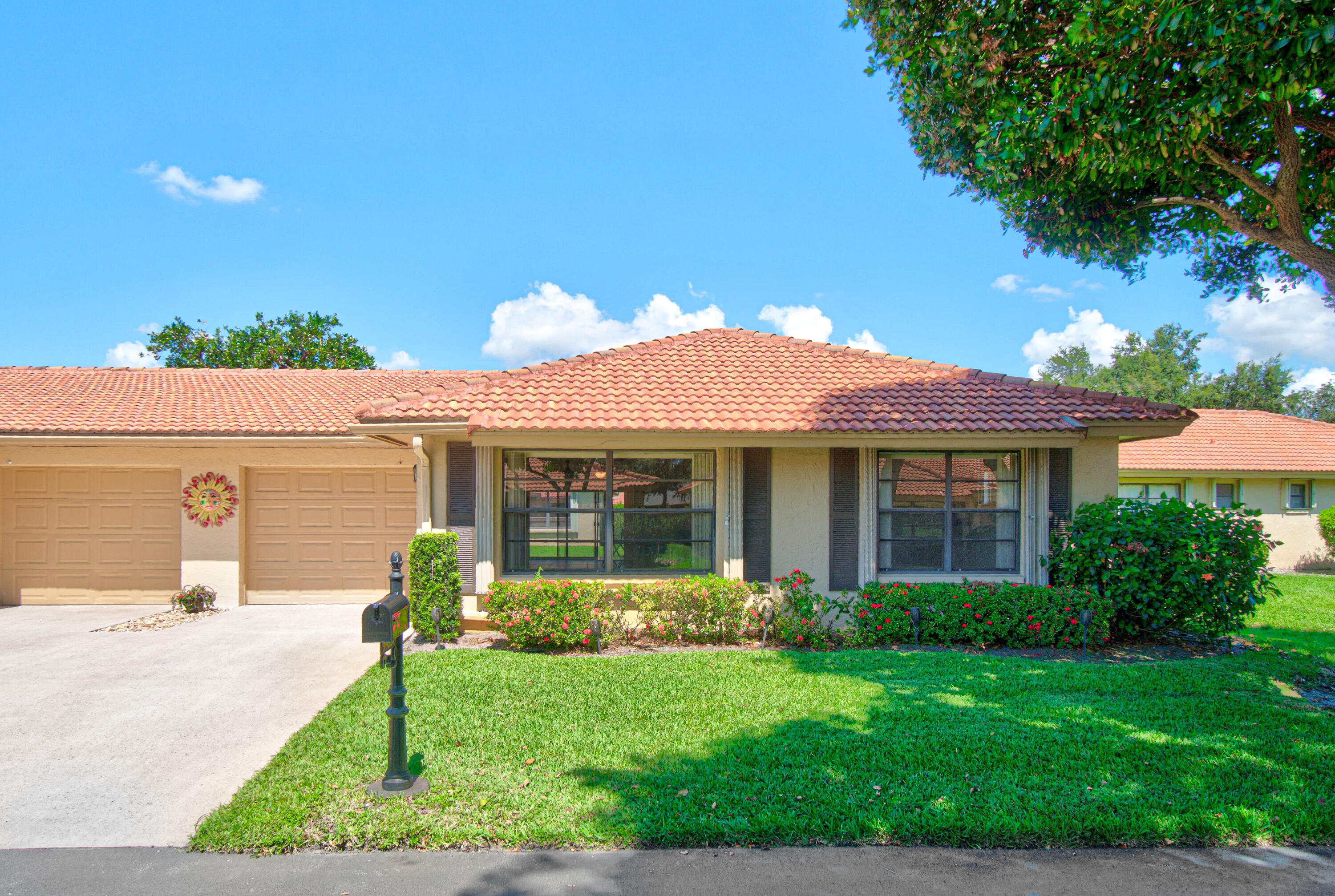 Charming 2-Bedroom, 2-Bath Villa with Garage! This well-maintained home features updated tile flooring throughout the main living areas, an open Florida room that adds extra living space, and newer A/C and water heater for peace of mind. Additional updates include a new electrical panel, newer washer and dryer, and stainless steel appliances in the kitchen. Enjoy a relaxed, low-maintenance lifestyle in a welcoming community designed for connection and convenience. Residents have access to a sparkling saltwater pool, clubhouse, library, and a variety of social clubs and activities. Association dues include water, basic cable, sewer, trash, roof and gutter maintenance, landscaping, and exterior building maintenance, making homeownership simple and stress-free. Located close to shopping, dining, entertainment, and top medical facilities, this villa offers comfort, convenience, and an exceptional value. Move right in and start enjoying all that this wonderful community has to offer!