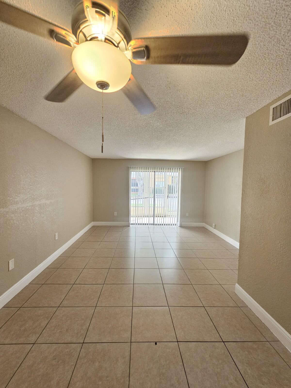 Spacious 2-bedroom, 2-bathroom corner unit on the first floor in the heart of Deerfield Beach. This well-maintained home offers 1,239 sq ft of living space with tile flooring throughout, an updated kitchen featuring granite countertops and stainless steel appliances, fully renovated bathrooms, decorative ceiling fans, fresh paint, and a new A/C system for year-round comfort. Conveniently located just minutes from I-95, shopping, dining, and major roadways. A great opportunity to enjoy comfortable South Florida living in a prime location.