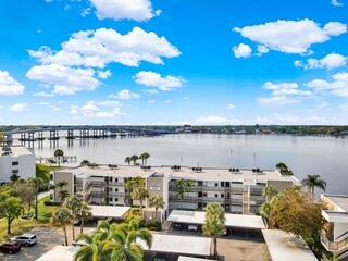 Wake up every day to breathtaking, tranquil riverfront views from this updated waterfront condo - perfectly positioned in the best location in the community. This spacious residence features a large, open floor plan designed to maximize natural light and showcase the stunning water views from nearly every angle. Impact windows and doors provide peace of mind while framing the picturesque scenery of passing yachts and sparkling water. Boating enthusiasts will love the convenience of dock space available at just $2/ft/mo. with direct ocean access - a true boater's dream. Whether you're seeking a serene full-time residence or the ultimate waterfront retreat, this exceptional riverfront condo delivers luxury, location, and lifestyle all in one. Active community with resort style amenities.