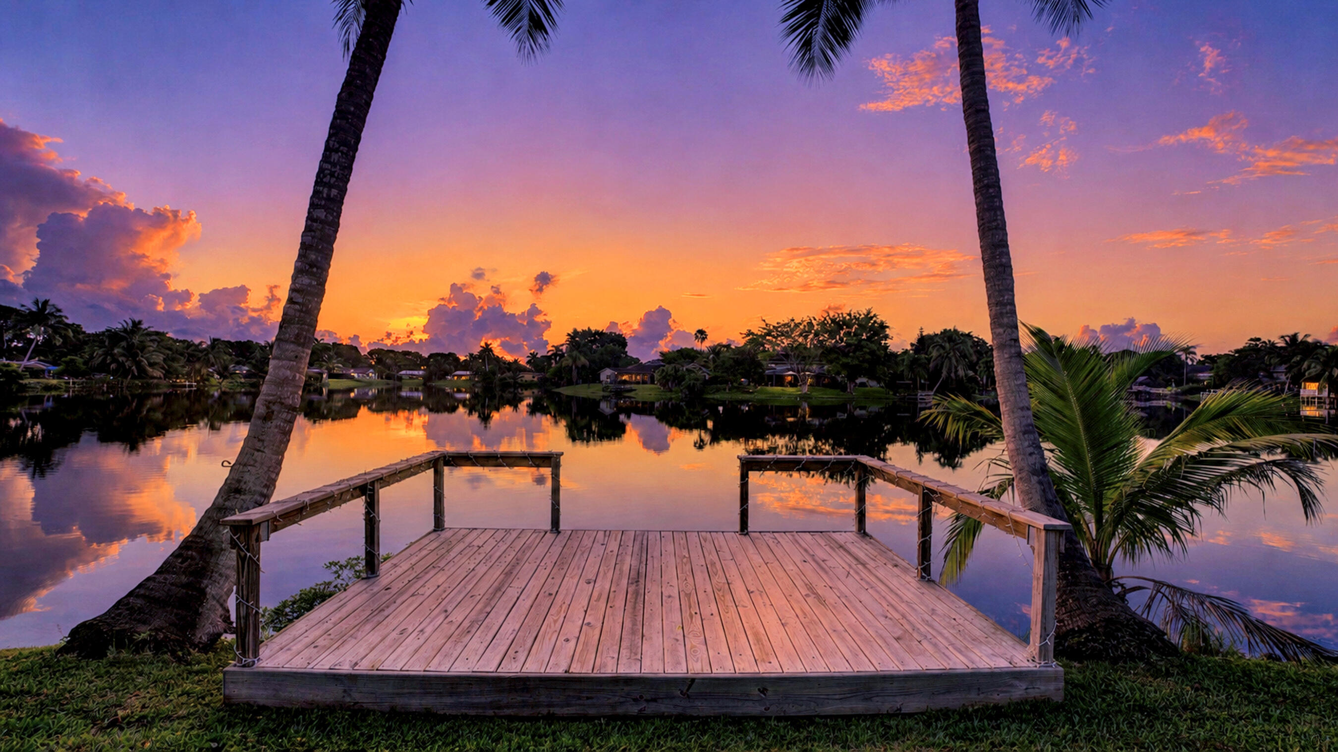 Start every day with breathtaking lakefront sunrises in this meticulously maintained 4-bedroom, 2.5-bath ranch-style home. Offering incredible value within Guardian Estates, this residence features stunning wood floors and an updated kitchen designed with a view of both the sparkling pool and the water. Peace of mind comes standard with newer major systems and full hurricane impact windows throughout. Step outside to your private oasis featuring a screened-in pool, perfect for relaxing or entertaining in the fresh air. Ideally situated near local amenities and essentials, this home perfectly blends comfort with a prime location.   This property is part of an estate sale; the seller will review all offers on 7/7/26 at 12:00 PM. Don't miss this rare lakefront opportunity.