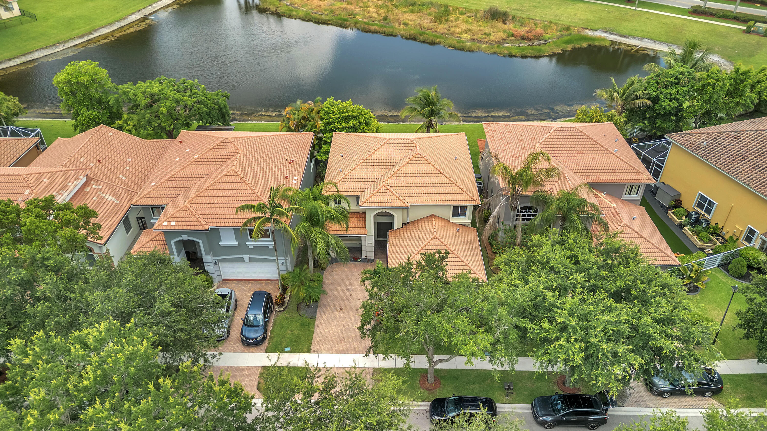 West Palm Be resort-style lakefront living in this spacious 4-bedroom, 3-bathroom home located in a gated community. Featuring a  first-floor bedroom and full bathroom, this home is perfect for guests, in-laws, or multigenerational living. Enjoy beautiful lake views and a low-maintenance lifestyle with HOA fees that include complete lawn care and 24-hour manned gated security.  Exceptional community amenities, including a resort-style swimming pool, children's splash pool, basketball and tennis courts, fitness center, pavilion, and picnic/BBQ areas. Situated in the heart of Palm Beach County, easy access to major highways and local attractions. Just 10 minutes from PBI Airport and I-95, 5 minutes from the Florida Turnpike, minutes to Wellington Green, Mall and close to Downtown PB!
