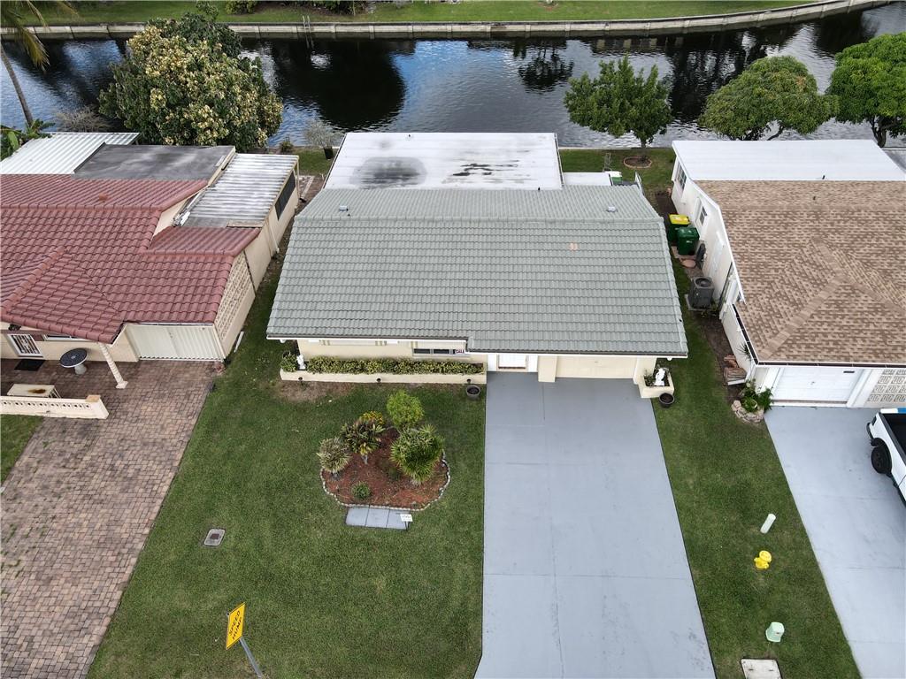 This 1-story 3 bedrooms and 3 baths overlooking the canal is perfect for entertaining and relaxing in the premier community of Tamarac the Mainlands of Tamarac. This property has been very well maintained and has had many upgrades a must-see. The credit score min is 725