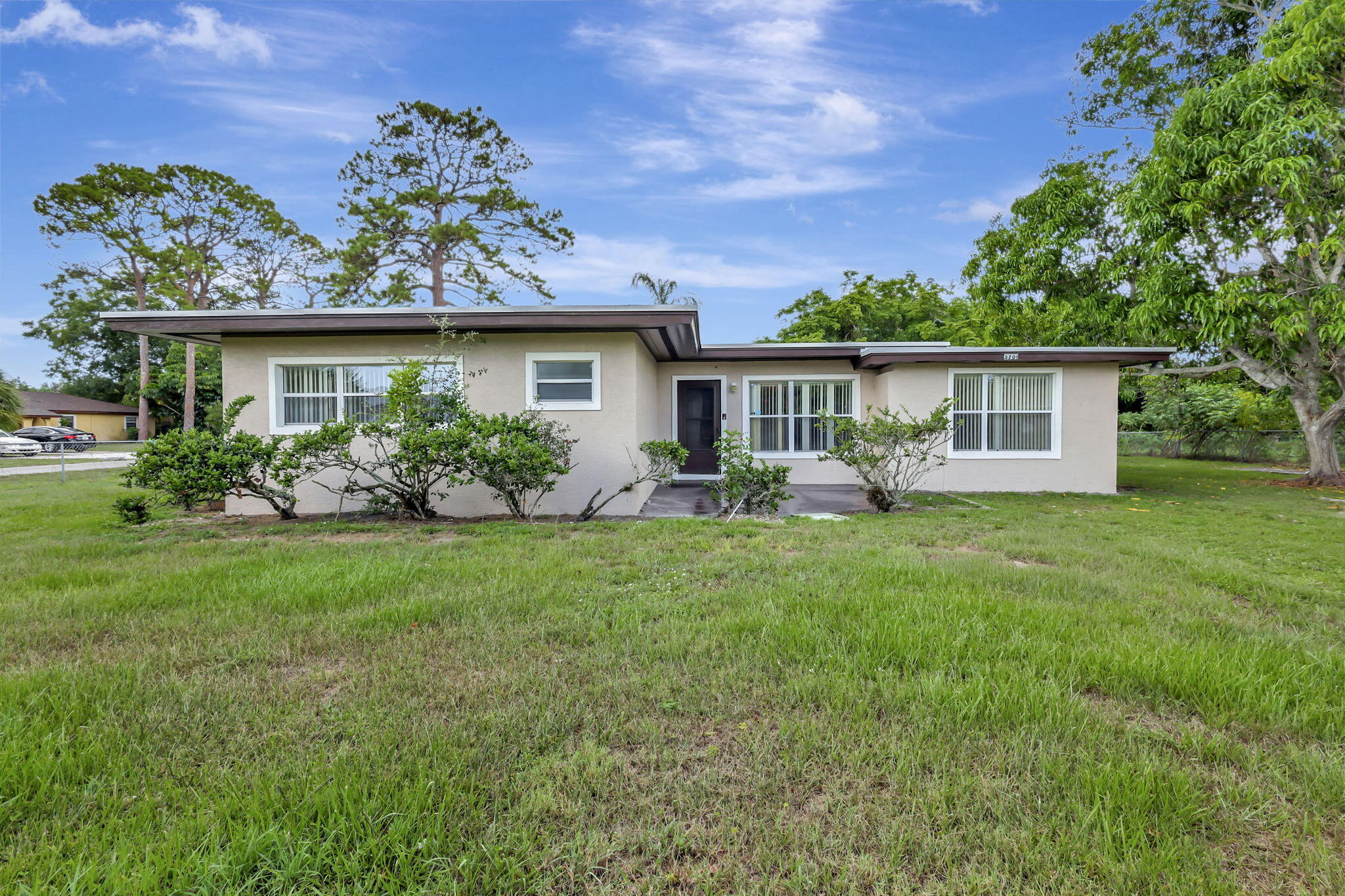 THIS HOME IS TOTALLY RENOVATED WITH NEW APPLIANCES, NEW FLOORS, BATHROOMS REDONE. NEW LIGHTING FIXTURES, NEW FANS, NEW AC, FRESHLY PAINTED INSIDE AND OUTSIDE. A MUST SEE! HOME SITS ON A DOUBLE LOT CONNER PROPERTY.  3 bedrooms, 2 full baths, huge additional room and oversized laundry room.