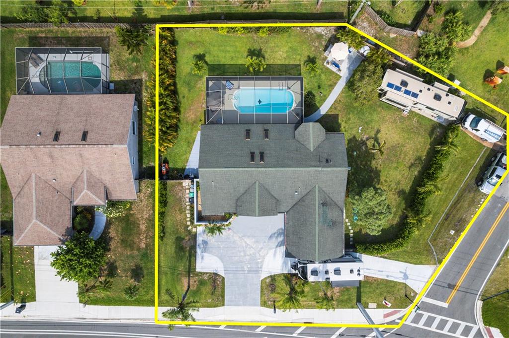 RARE FIND! Huge lot. Almost like new construction! CBS pool home on almost half an acre corner lot w/fenced yard, screened enclosed pool. Open concept home w/wide living room. Kitchen w/bay window, breakfast nook & french doors. New hot & cold water lines, new impact Windows living areas, pool just resurfaced, salt water system. New concrete driveway, new kitchen cabinets appliances & countertops, pad for RV or boat, Perfect back yard for entertainment also includes a custom made new brick pizza oven, freshly painted, commercial grade laminate floors throughout, huge walk-in closet in master, out door shower (hot & cold). Tankless water heater NEW pool pump, new irrigation pump w/new timer. Outdoor tv in covered patio. NEW Camera system. Close to boat ramp w/ocean access. Riverwalk area.