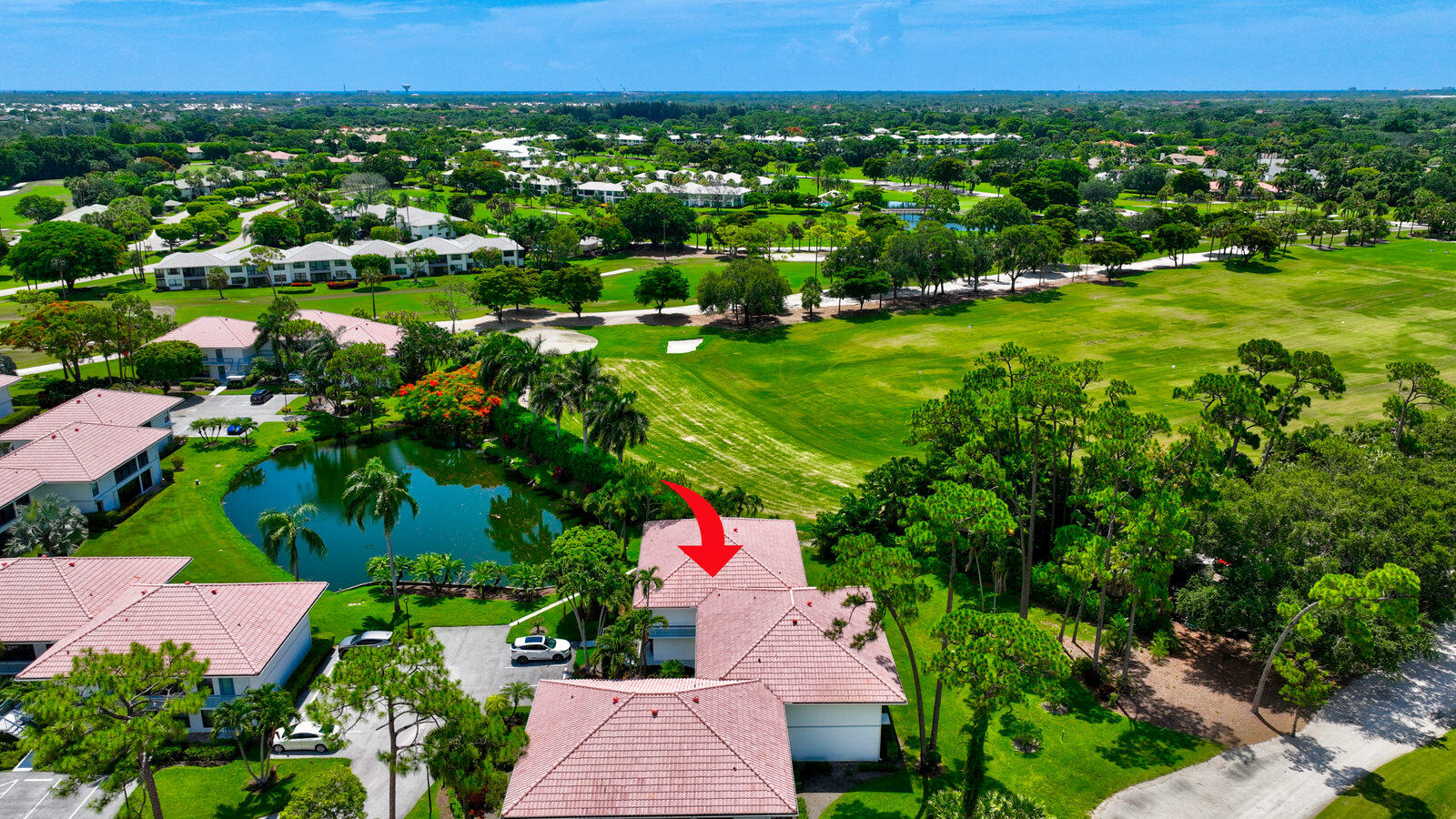 Fantastic location for the golfer(s) in the family - just steps away from the Quail Ridge driving range. This updated 2 BR, 2 BA second floor corner unit boasts panoramic golf & water views. Bright open floor plan featuring Porcelain tile throughout. Custom Plantation shutters and decorative fixtures. Updated eat-in kitchen. Large living room, dining area with dry bar.  Spacious primary bedroom with a generous sized  custom walk-in closet. Second bedroom has two custom closets. The Florida room overlooks the garden & driving range and is perfect for an office, exercise room, or serene setting for dining and relaxing. 2025 A/C. Newer washer & dryer. Walk to all the wonderful amenities Quail Ridge has to offer its