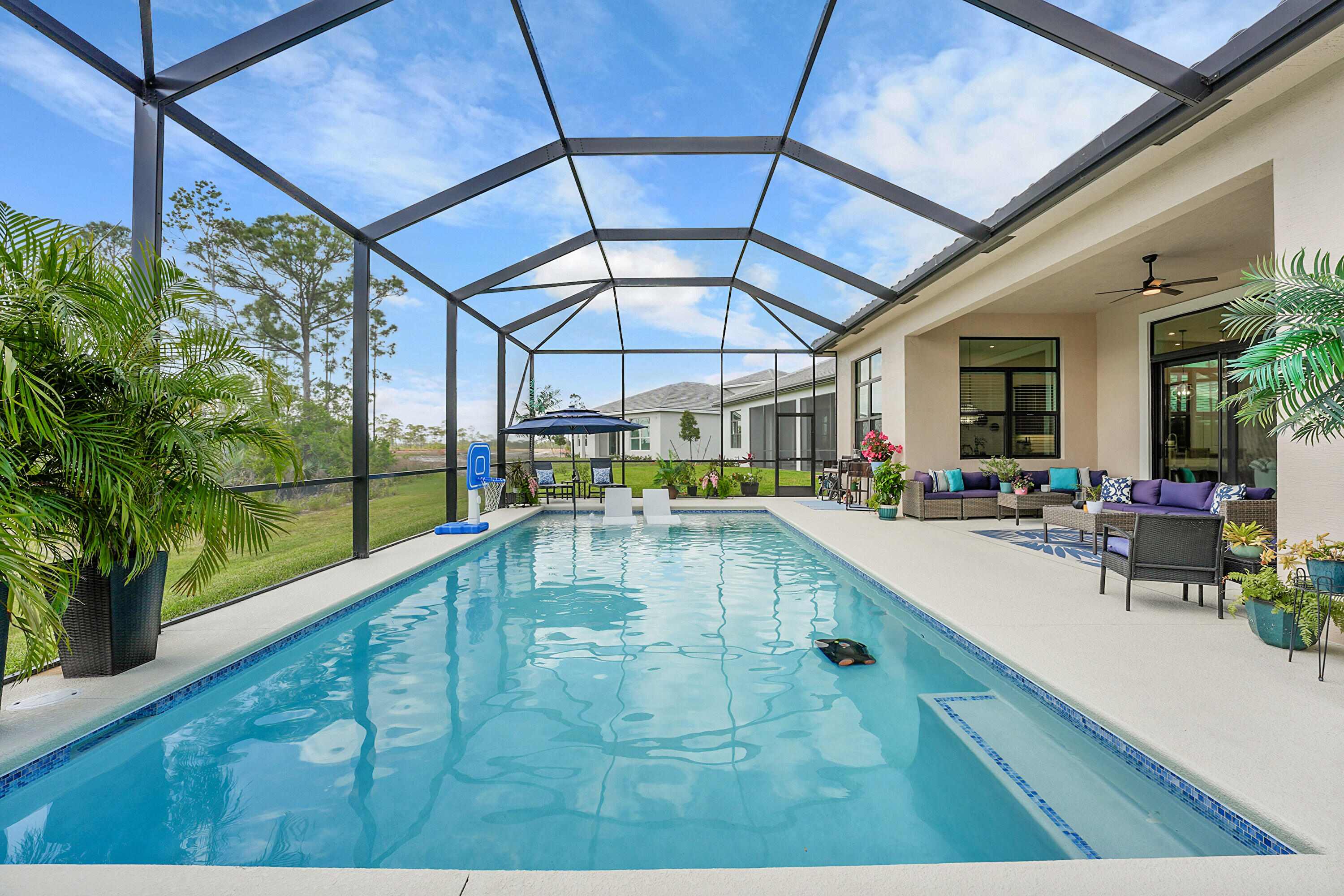 1YR NEW Kolter POOL home Meticulously maintained and beautifully appointed with custom lighting designs, 3 bedroom plus flex room perfect for 4th br, office, media room or play room, 3.5 baths and over 2500SF with tile floor throughout, stainless steel appliances and magnificent quartz counter tops plus a huge pantry! Brand new custom designed pool and oversized screen enclosure. The primary retreat is breathtaking with its luxurious spa shower, custom built in closets and double quartz vanities. Each bedroom has an ensuite bath plus a powder room for guests. The spacious laundry room also affords extra storage space. What a superior home to entertain in with the grand kitchen open to the living room and formal dining area with triple pocket sliders. The custom pool package by A&G pools Will leave you speechless as it truly feels like you are away on your own tropical island backing up to a preserve area for a bit of privacy. The home is just a stones throw from the magnificent communities features, a resort style pool, tennis and pickleball courts in this lovely gated community just minutes from I95 and the Turnpike and also close to shopping and restaurants and just a few miles the our fabulous Beaches. We look forward to showing you this truly special home! #ComeJoinUs