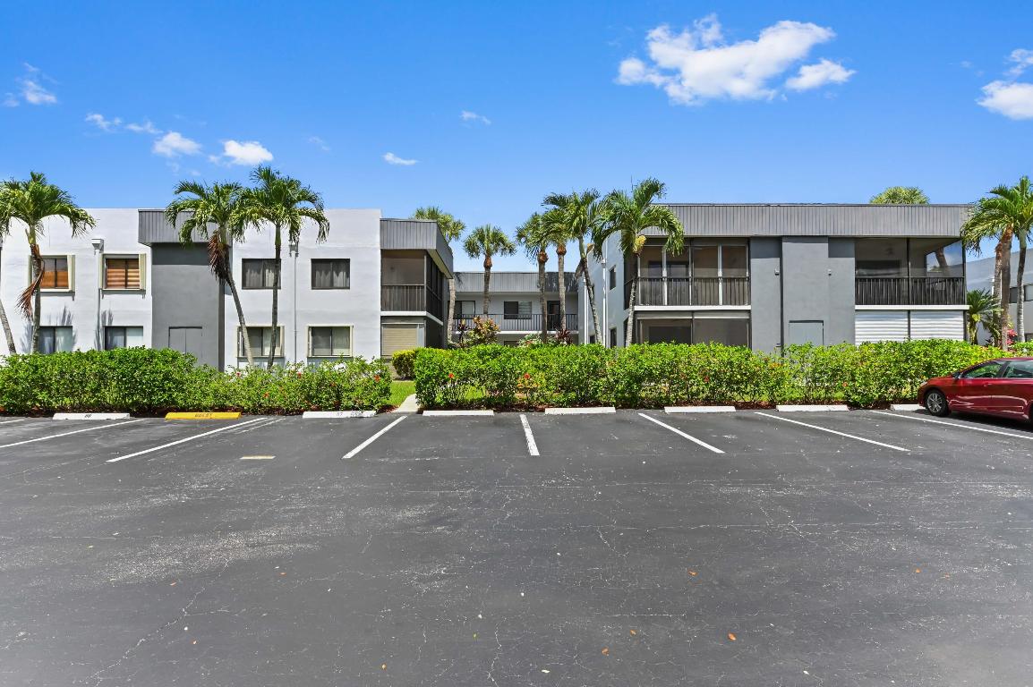 Ground floor, corner-unit lakefront condominium located across the street from the clubhouse in desirable Lakes of Delray neighborhood. Charming open-concept floor plan with elegant ceramic tile offers a variety of design options and expansive space. Updated kitchen includes ample cabinet and counter space; adjoining dining area is bright and cheerful. Elegant owner's suite features double closets, patio access, and updated en suite bath. Charming Florida room offers a perfect place for extra seating, dining, and entertaining space while enjoying that gorgeous lake view. You'll love life in gated Lakes of Delray. This active adult condominium community offers all of the amenities and social activities you're looking for including multiple pools and spas, tennis and pickleball courts.