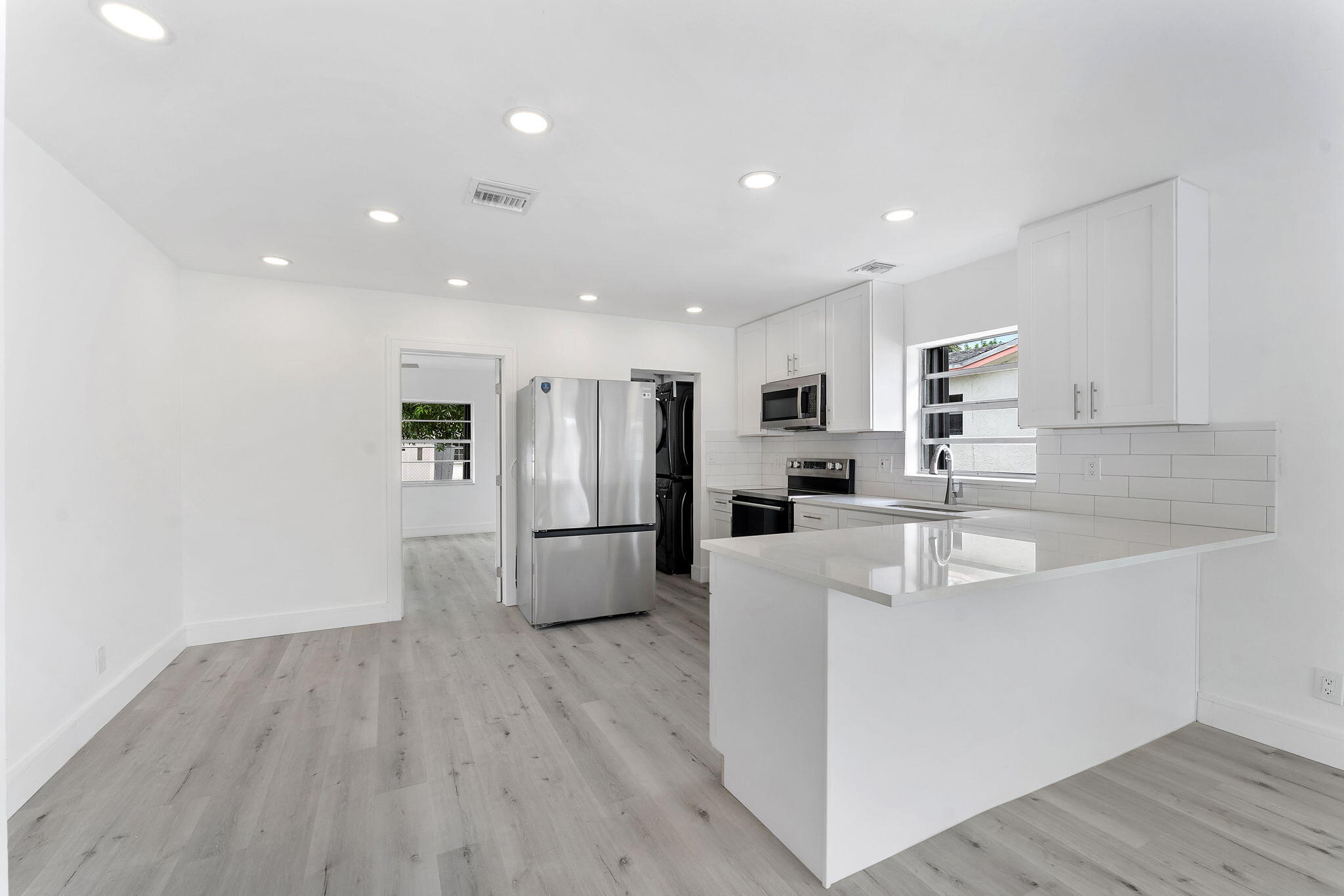 Tucked into one of Deerfield Beach's most sought-after neighborhoods, this fully remodeled 5 beds/3 baths home blends inspired design with effortless living. A show-stopping chef's kitchen with top-of-the-line appliances anchors the home, while a thoughtful split-bedroom layout leads to an extraordinary primary suite that feels like a private retreat. Every bathroom has been meticulously crafted, pristine flooring flows throughout, and the oversized fenced backyard offers room to relax, play, or entertain.  Then there's the surprise: a one-of-a-kind detached office with its own bathroom—an unforgettable space for work, creativity, guests, or a private studio. It simply has to be seen to be appreciated. Professionally managed for exceptional service