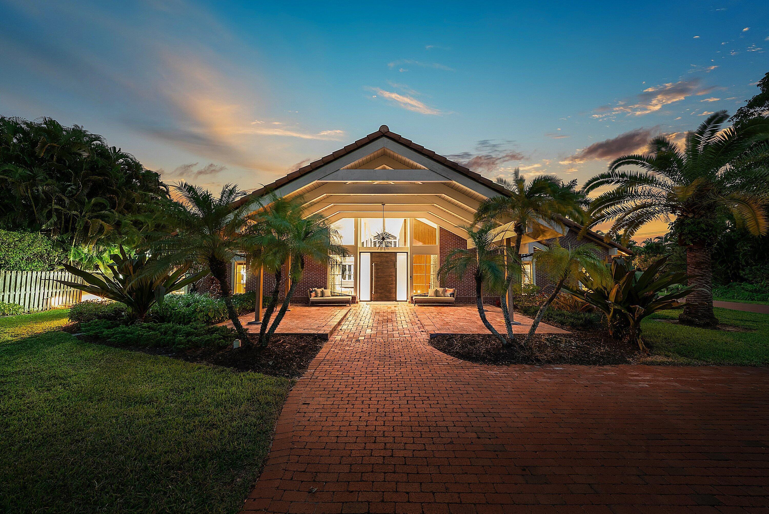 Contemporary Boca Raton Masterpiece with private 82-foot Olympic-like Heated Saltwater Pool and Spa and Impressive Decorative Stone Courtyard with Waterfall Features Throughout. A Tiki-Hut lounge-area and massive backyard complete the property. Welcome to a realm of unparalleled luxury at 6641 Giralda Circle in central Boca, a stunning 5-bedroom, 6.5-bathroom newly renovated and expanded from 2022-2023 on an incredible 1.55 acre lot with the finest craftsmanship and imported finishes throughout. Sleek lines and bespoke European finishes permeate every inch of this captivating single-story, 5,990-square-foot under-air residence with 8,146 total square-feet. Ornate A-frame ceiling details add a unique warm grandeur with custom wood and stone wall coverings that infuse warmth and style into