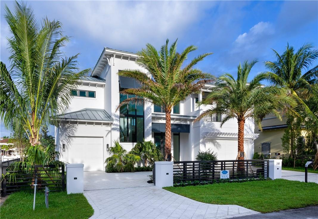 Brand New Coastal-Inspired Deepwater Estate sited on 80' +/- of waterfrontage with wide water views of Lake Placid. Built by renowned Albanese Home Builders, this exceptional new estate features impressive light-filled interiors from nearly every major room. Outdoor entertaining is enjoyed at the expansive covered loggia with roll down screen and resort-style pool with infinity edge spill-over spa. 80'+/- yacht dock minutes to the Hillsboro Inlet for the avid boater.