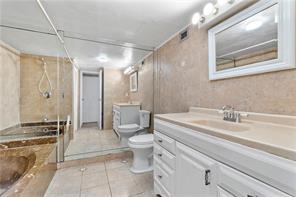 Spacious and versatile 1-bedroom unit, thoughtfully converted into a 2-bedroom with a sleek sliding door that separates the bedroom from the living area—perfect for privacy or an open-concept feel.This bright residence features 2 full bathrooms, floor-to-ceiling windows, and generous closet space throughout. Enjoy the convenience of 1 assigned parking space, along with guest parking and permitted street parking options.Located in the highly desirable Three Islands community, this property offers resort-style amenities including tennis courts, a heated pool, hot tub, sauna, fitness center, game/card room, and billiards. Rent includes Hotwire basic cable, internet, water, and pest control. Ideally situated just minutes from the beach, top dining spots, casinos, and the iconic Hollywood Beach TIME TO SELL: THIS. IS A LARGE UNIT WITH A FULL SECOND BATHROOM Buyer must sign FIRPTA.  There is a lockbox in the storage room, in the back of the laundry room, there is a door that leads to the storage room GO AND SHOW AND SELL!