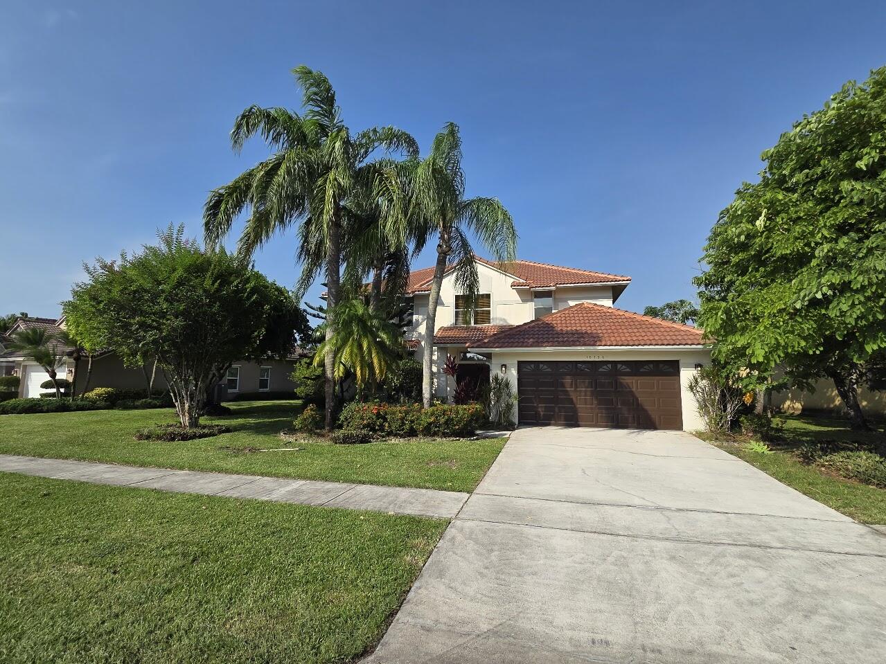 Beautiful 4-bedroom, 2.5-bath two-story lakefront home with a screened-in pool and Jacuzzi, offering breathtaking water views. This move-in-ready home features a formal dining room, spacious family room, 2-car garage, two new A/C units, fresh interior paint, updated light fixtures, and beautifully remodeled bathrooms. Enjoy Florida living at its finest in the highly desirable The Lakes at Boca Raton community, featuring resort-style amenities including a community pool, fitness center, playground, picnic and BBQ area, basketball courts, soccer field, and tennis courts. Basic cable is included. Conveniently located just 20 minutes from the beach and within one of Boca Raton's top-rated school districts, with access to some of the area's best schools.