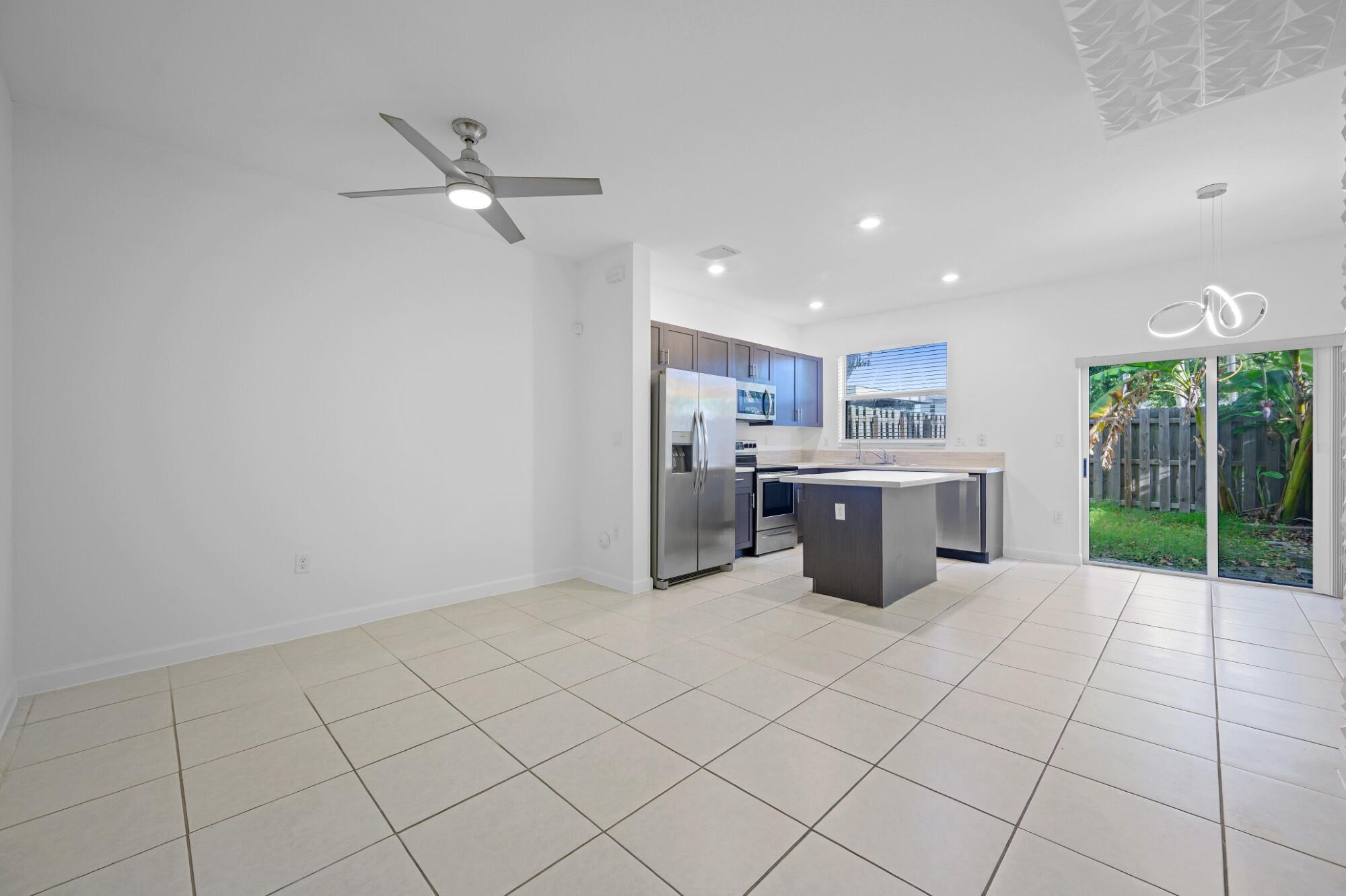 Modern 2021 townhouse in Riviera at Keys Gate featuring 3 bedrooms and 3 full bathrooms, including a desirable first-floor bedroom with full bath ideal for guests or home office. Open-concept layout with quartz countertops, stainless steel appliances, and island connecting kitchen, dining, and living areas. Upstairs bedrooms offer privacy with en-suite bathrooms. Bright interior with functional layout. 2 assigned parking spaces in front plus guest parking. Resort-style community with clubhouse, pool, and gym. Conveniently located near Turnpike, shopping, dining, and easy access to the Florida Keys.