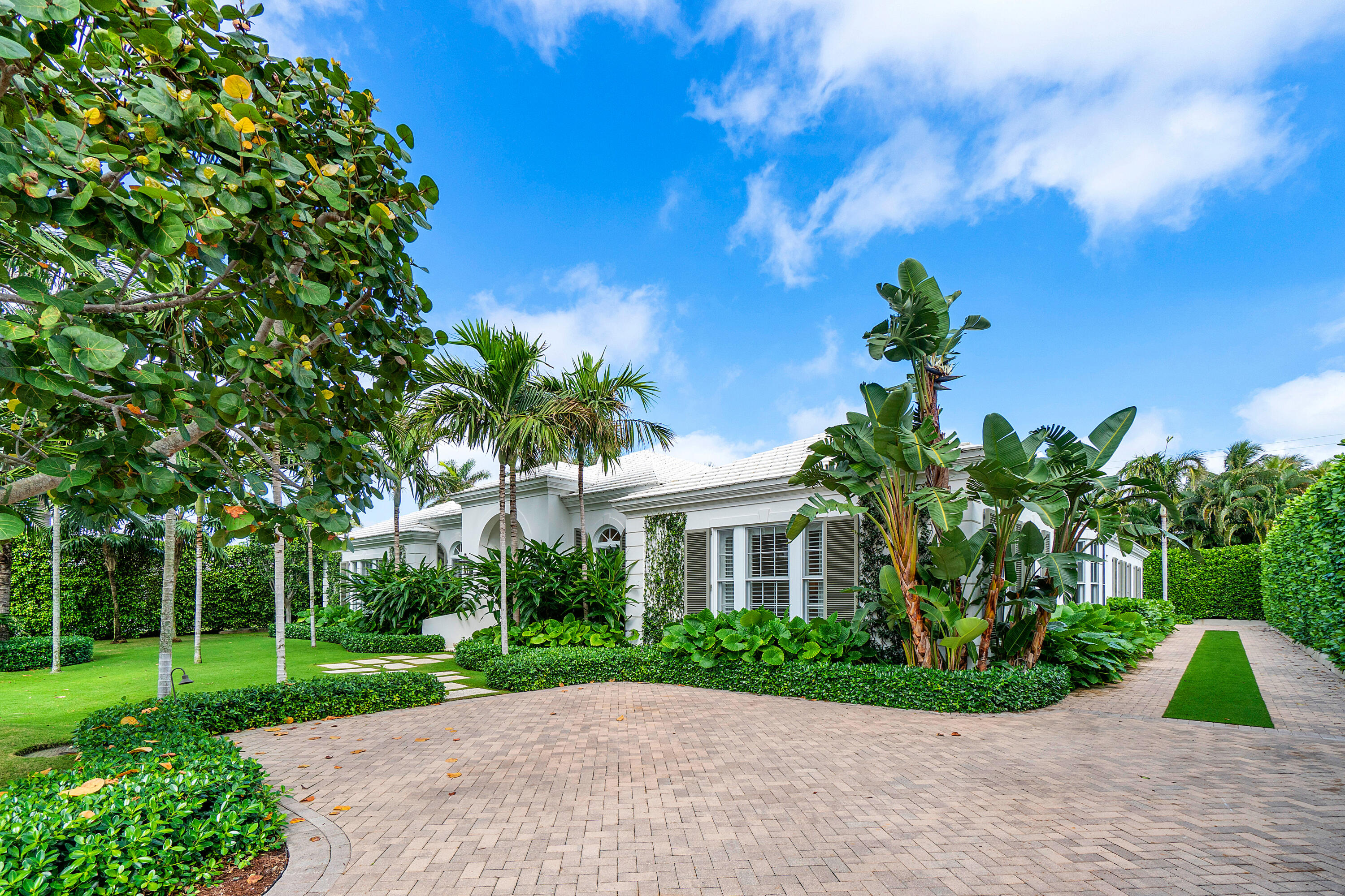 Incredible Bermuda-style home built by Wittmann Builders on an oversized 14,000+ sq ft lot. This chic single-story home offers 5,353 total square feet with 4BR/5.5BA, premium millwork and high ceilings. Oversized living room w/ gas fireplace upon entry, overlooking loggia, lush gardens and pool. Gourmet kitchen. Spacious primary suite his/her bathrooms and walk-in closets. All guest bedrooms feature en-suite bathrooms and custom closets. Large loggia with retractable sliding glass doors is perfect for entertaining. Whole-house generator, air-conditioned two car garage with storage system, and much more.