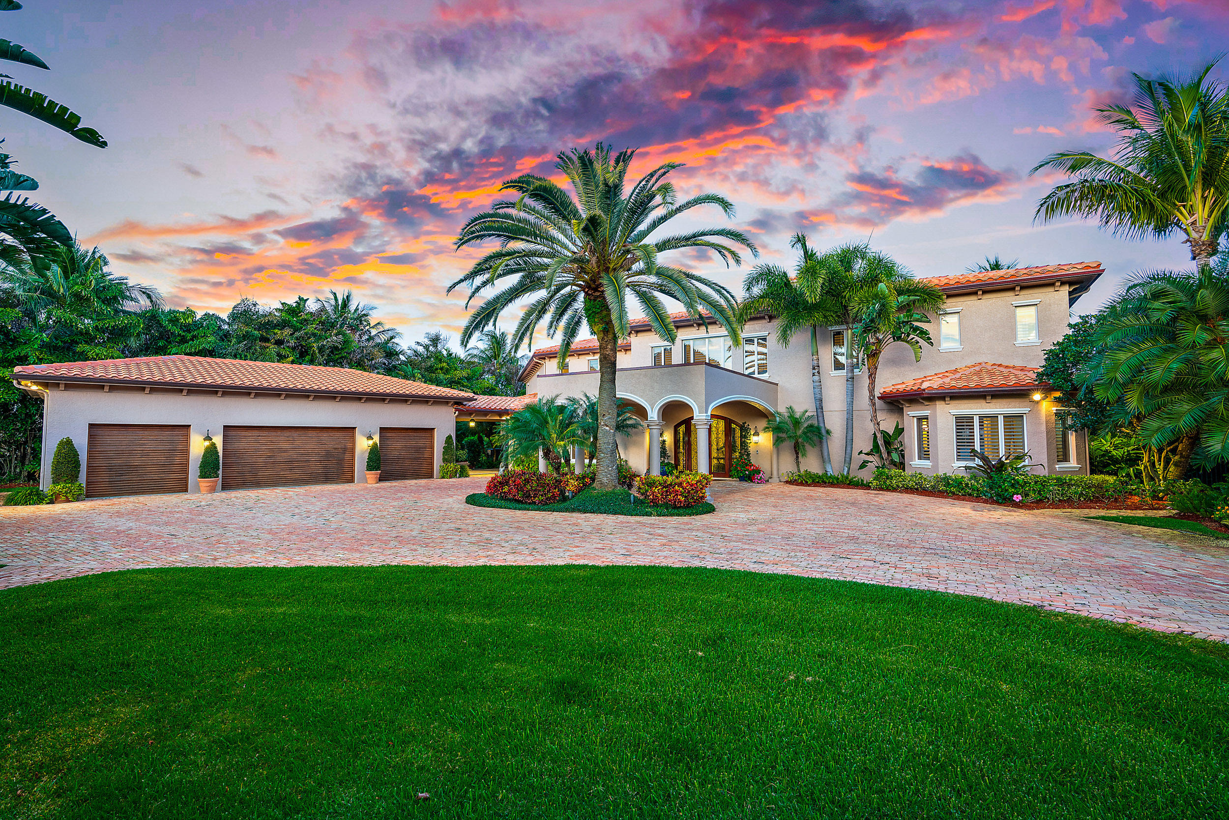 Where the Loxahatchee River meets the North Fork you will find a protected cove with blue water.  This 1.4 acre gated estate has an eastern exposure. Chicago Brick paver driveway, lush tropical landscaping abounds to the Porte-cochere and motor court. Two story home, with 4 car garage overlooking the beautiful Loxahatchee River. Enjoy blue water on incoming tides year round. Handcrafted entry doors lead to an elegant entry foyer with a coastal flair.  Custom traditional wood work includes wood ceilings, custom moldings and walls. Two way gas fireplace in the main living room to the study. Private dining room can accommodate 10 or more. First floor master or an elevator across a bridge to a grand master suite with breakfast bar, sitting room, private balcony, his and her private baths and walk-in closets, and a private laundry room. Two guest bedroom suites with a private patio.  The family great room combined with the kitchen, breakfast bar, eating area, wet bar, wine cooler. Kitchen features, spacious breakfast bar for up to 6 people, sub-zero fridge and freezer, Viking stove, 4 burner s  and griddle, double ovens, warming drawer, and custom built-in pantry   Two propane gas tanks for the whole house generator, pool /spa and outside barbeque. Outside covered patios are ideal for outside living. Guest house has kitchen, living-room, full bath, laundry, and two car garage. Two Boat docks three lifts include; one 30,000lb lift, and two 10,000 lb lifts. Seawall was replaced in 2009, main house roof replaced in 2019. Clay tennis courts resurfaced March 2020,