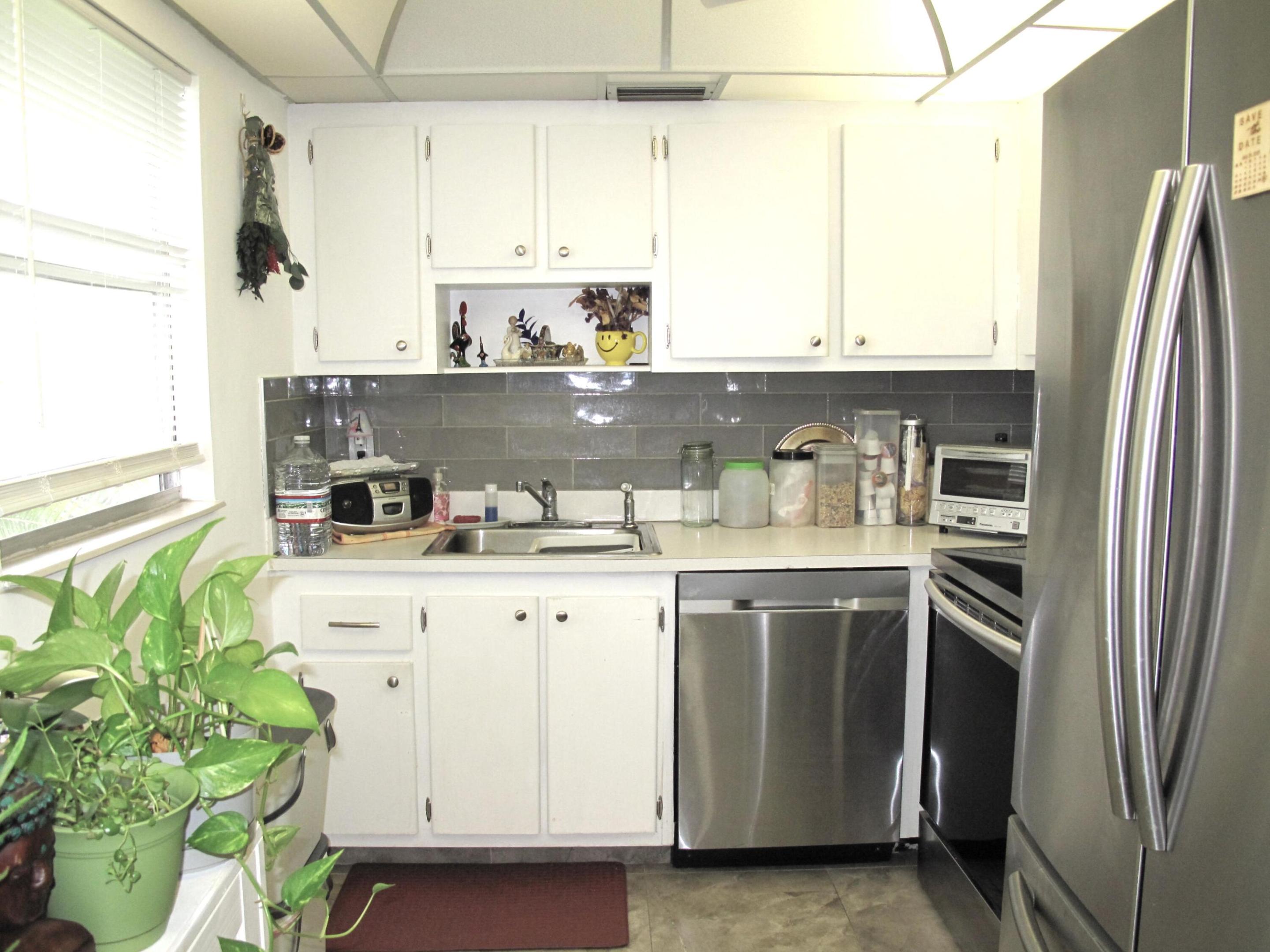 Bright and airy 2nd floor corner condo w/lift in desirable Kings Point, an active Adult 55+ community. Spacious floor plan. Condo features: newer A/C 2018, 2024 water heater, new SS appliances, glass backsplash in kitchen, New neutral tile flooring throughout (no Carpet), ample closet space. Enjoy your lovely screen-enclosed balcony, where you'll find a new washer and dryer. You'll love the world-class amenities of Kings Point, including two 18-hole golf courses designed by Robert Trent Jones, Sr, a large resort-style pool and clubhouse, tennis, pickleball, and fitness room. Enjoy the state-of-the-art theatre, East End Café in the main clubhouse & The Bistro in the Monaco clubhouse. there's always something to do in this vibrant 55+ community, including   entertainment, education, recreation, & social events. Manned gate, security features, and a courtesy shuttle bus service for your comfort and convenience. Close to all amenities: places of worship, just a short ride to the beach and downtown Delray, Turnpike, restaurants, and more.