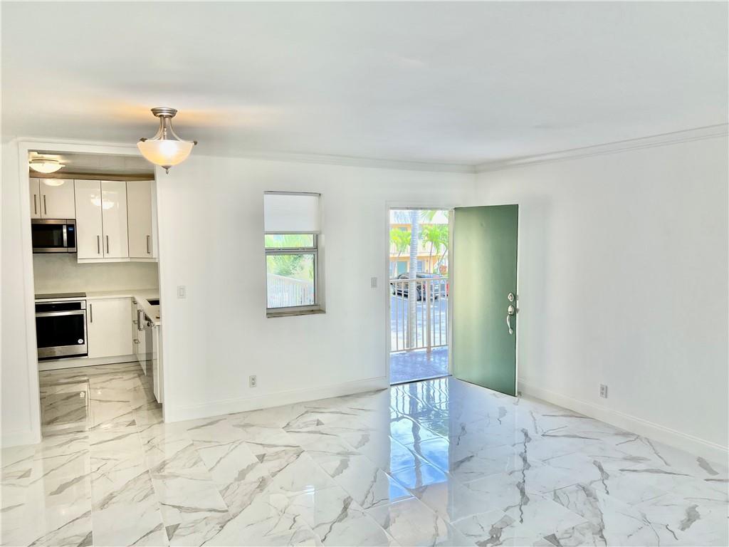 Clean, bright and renovated 2 bedroom, 2 bath condo in the upcoming Oakland Park! Welcome to your brand new modern kitchen, brand new appliances, an owner's en-suite, walk-in closets with closet systems, walk-in showers with glass doors, split bedrooms, sound proof tiles, Quartz countertops, flat panel glossy white cabinets, crown molding, freshly painted, 4 y/o AC unit, washer & dryer in unit, water purifier, ample closet space, and pet friendly!. Walk your dog across the street to Funky Buddha Brewery, JACO Park, or any of the new restaurants in the Downtown Oakland Park District. Have the best of both worlds, close to the beach and a quick drive to major highways. Investor or Primary Resident, and pet friendly! Can rent right away! Come home to your completely renovated 2 bedroom, 2 bath condo. Brand new kitchen, master en-suite, washer & dryer, pet friendly, and walkable to breweries, parks and restaurants. A short drive to the beach and major highways. Investor and pet friendly. Can rent right away.