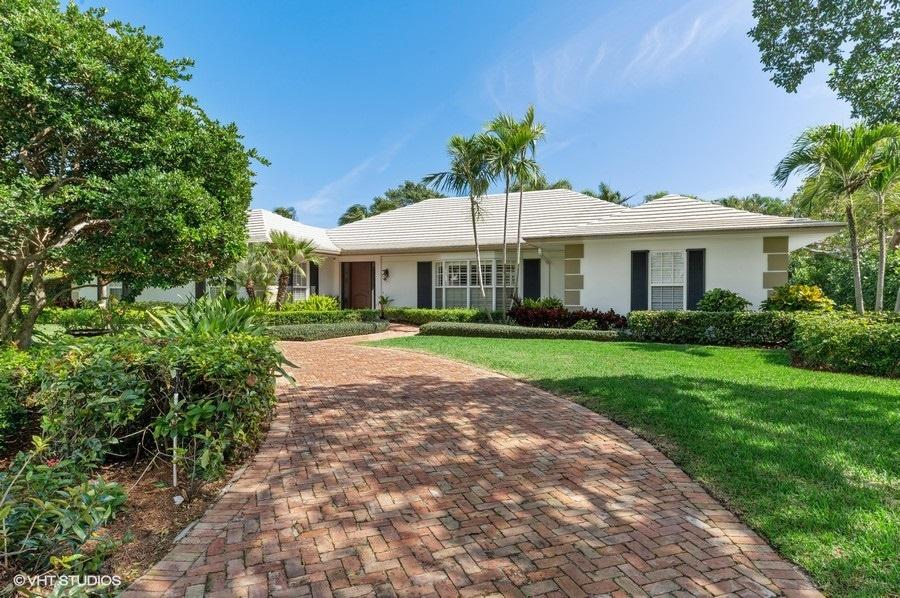 Located on first green of Lost Tree Club, this single story 4 bedroom, 4 bath home with pool and hot tub has lush landscaping, privacy hedges, hurricane windows and doors, whole house generator, family room, kitchen all stainless, propane, spacious yard with child pool fence. A special opportunity to acquire a pristine home in Lost Tree Village. An oceanfront community with full sporting amenities.