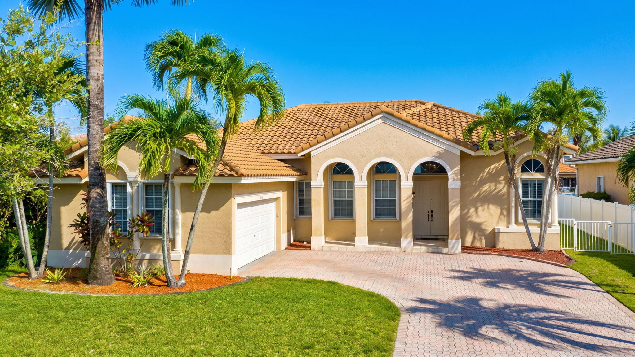 OPEN HOUSE 07/18 1PM-4PM Waterfront views and exceptional upgrades come together in this inviting single-story home. Located within the gated community of Spring Valley Estates in West Pembroke Pines, this residence features a 2022 roof and full accordion hurricane shutters, offering added peace of mind and insurance savings. Inside, soaring volume ceilings and abundant natural light create an open, airy atmosphere, while a versatile flex space adapts effortlessly to your lifestyle—ideal for a home office, fitness room, playroom, or a fourth bedroom. The primary suite features custom-built closet organizers that maximize both style and functionality, and both bathrooms have been newly renovated with clean, contemporary finishes. Step outside to wide canal views and an oversized waterfront fenced lot with plenty of space to design the backyard you've always envisioned, including room for a custom pool. Blending a flexible floor plan, meaningful updates, and a picturesque waterfront setting, this home offers the perfect balance of everyday comfort and future possibilities.