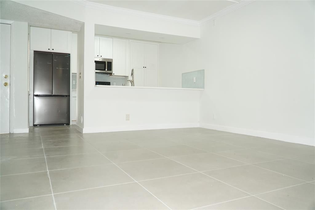 Step into this beautifully updated 3-bed, 2-bath first-floor condo, offering modern finishes and a bright, welcoming feel. The renovated kitchen boasts stainless steel appliances, complemented by sleek tile flooring and freshly painted interiors. Relax with your morning coffee or unwind at sunset in your peaceful private outdoor area. **No rental restrictions own great for investment or end user**