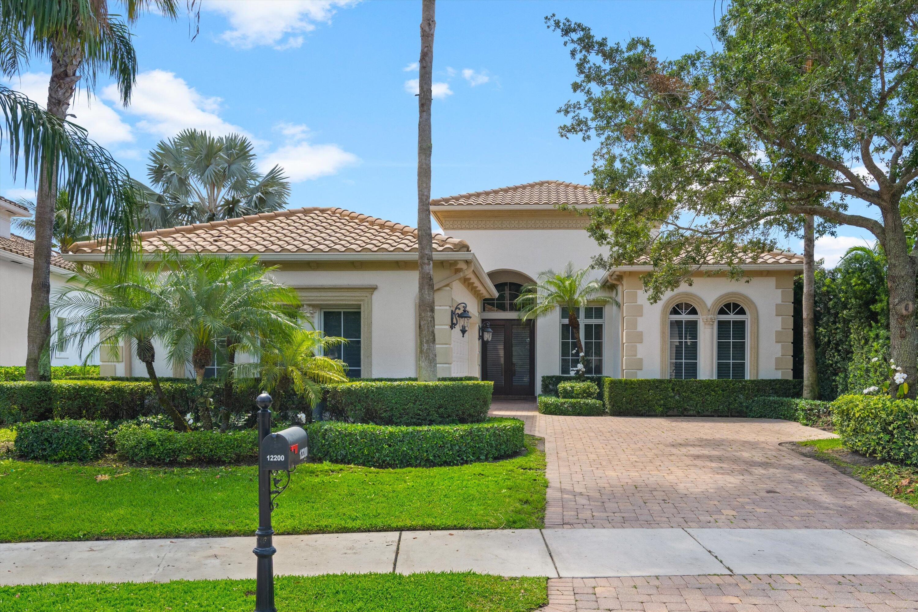 Enjoy the ultimate Wellington lifestyle in this elegant one-story estate, ideally located in the prestigious, gated community of Palm Beach Polo Club—just minutes from all major equestrian venues, including WEF, Global Dressage, and NPC. This spacious 4-bedroom, 4-bathroom home offers a bright, open layout with soaring ceilings, a split floor plan, two dining areas, a wet bar, and a cozy living room perfect for unwinding after a long day. Three of the bedrooms feature ensuite bathrooms, providing privacy and comfort for guests and family. Outdoors, take in sweeping views of open green space and a tranquil pond from the expansive patio. The heated pool and built-in BBQ make this the ideal spot for entertaining or relaxing in style.